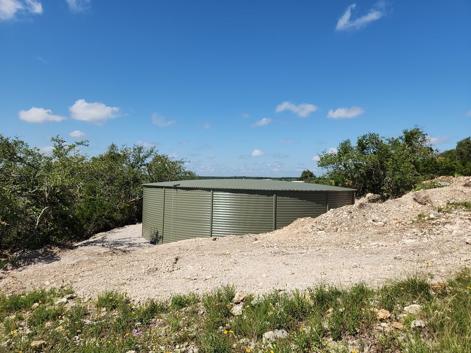 Residential Rainwater Collection System - Pioneer 40K gallon water tank in Mangrove Green by Hill Country Rain Water