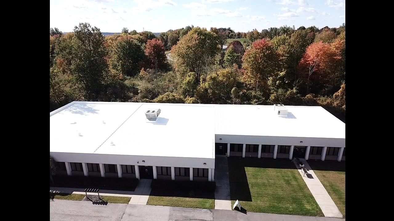 Commercial Metal Roof Coating by Gold Star Roofing LLC