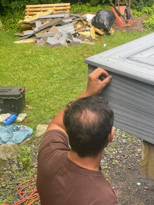 Raised Gray Composite Deck and Staircase Construction in Pocono Summit, PA
