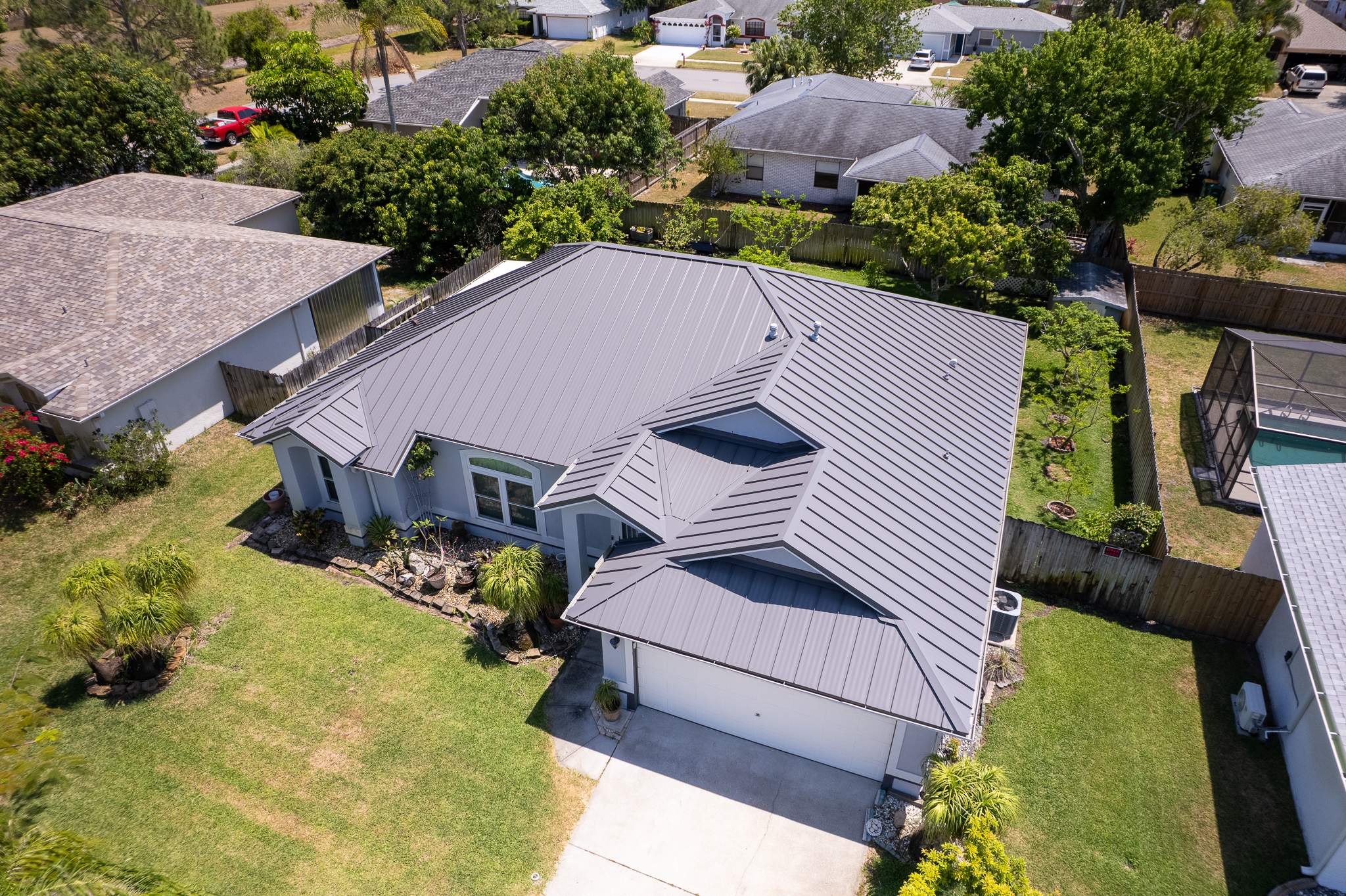 Complete Metal Roof Replacement and Seamless Gutter Installation in Melbourne by Wiedmann Construction & Roofing