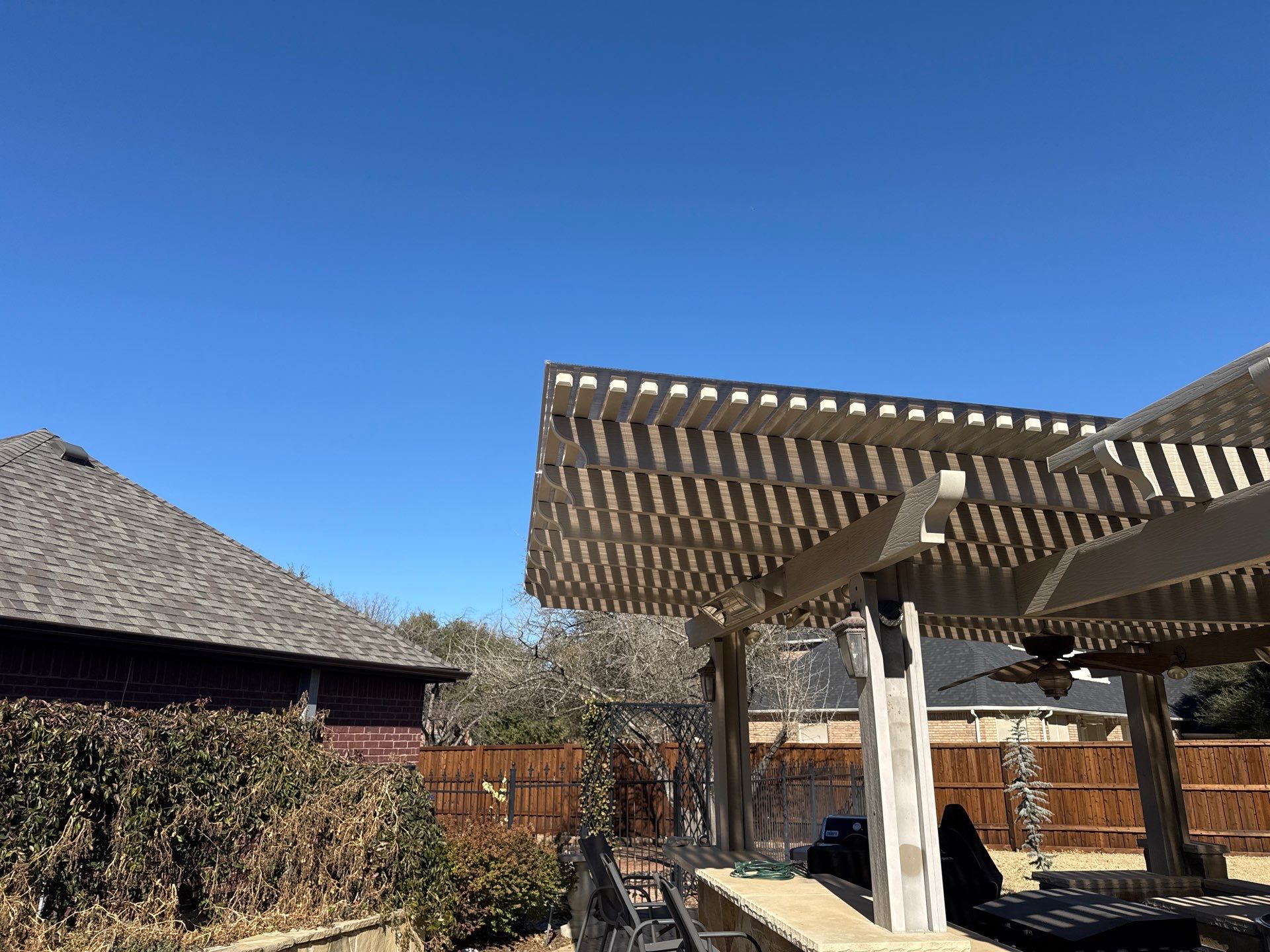 Polygal twin wall roofing system using 8mm bronze twin wall polygal by Grizzly Fence And Patio