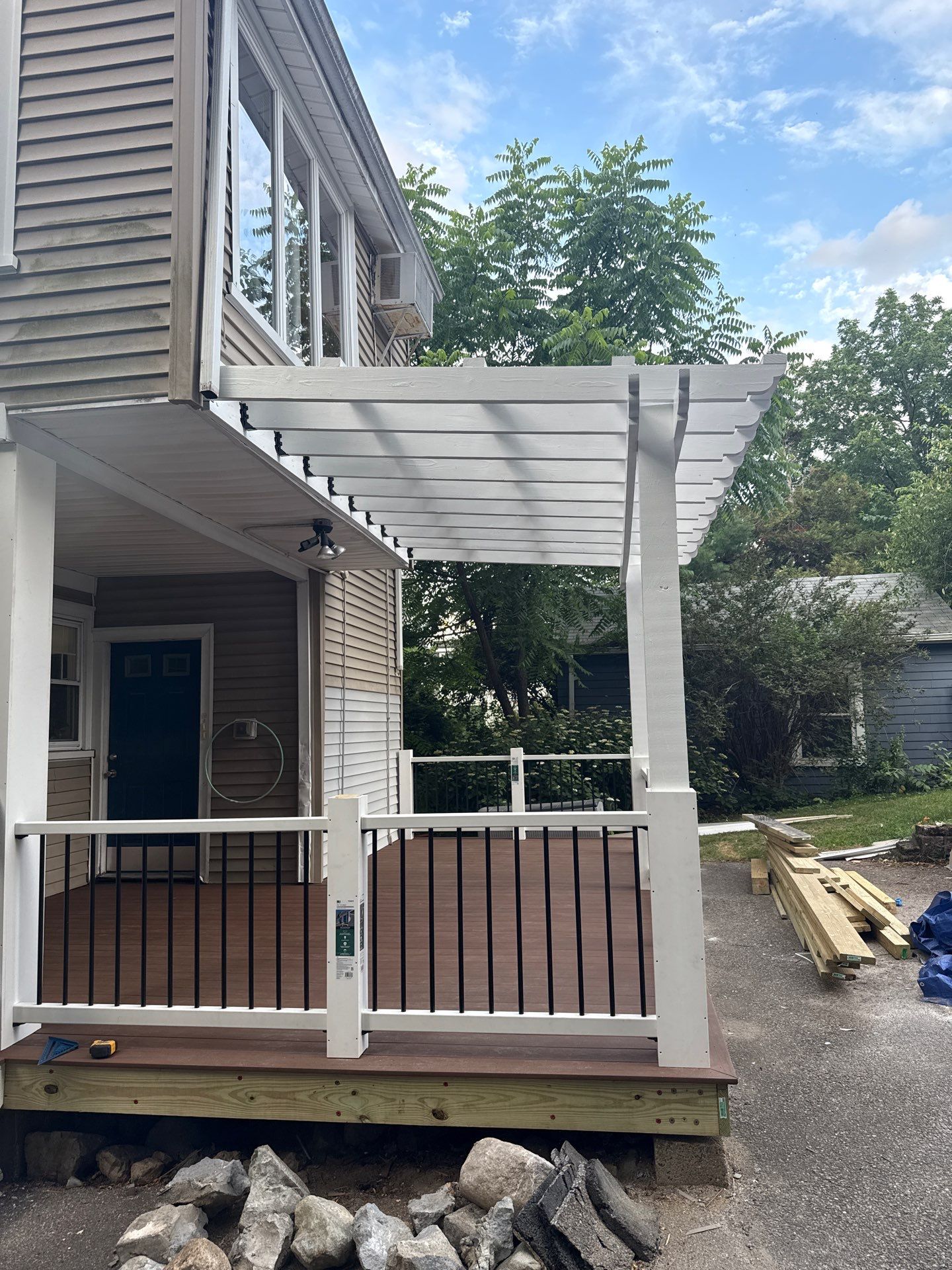new deck with custom pergola by CabralCarpentry & Painting LLC