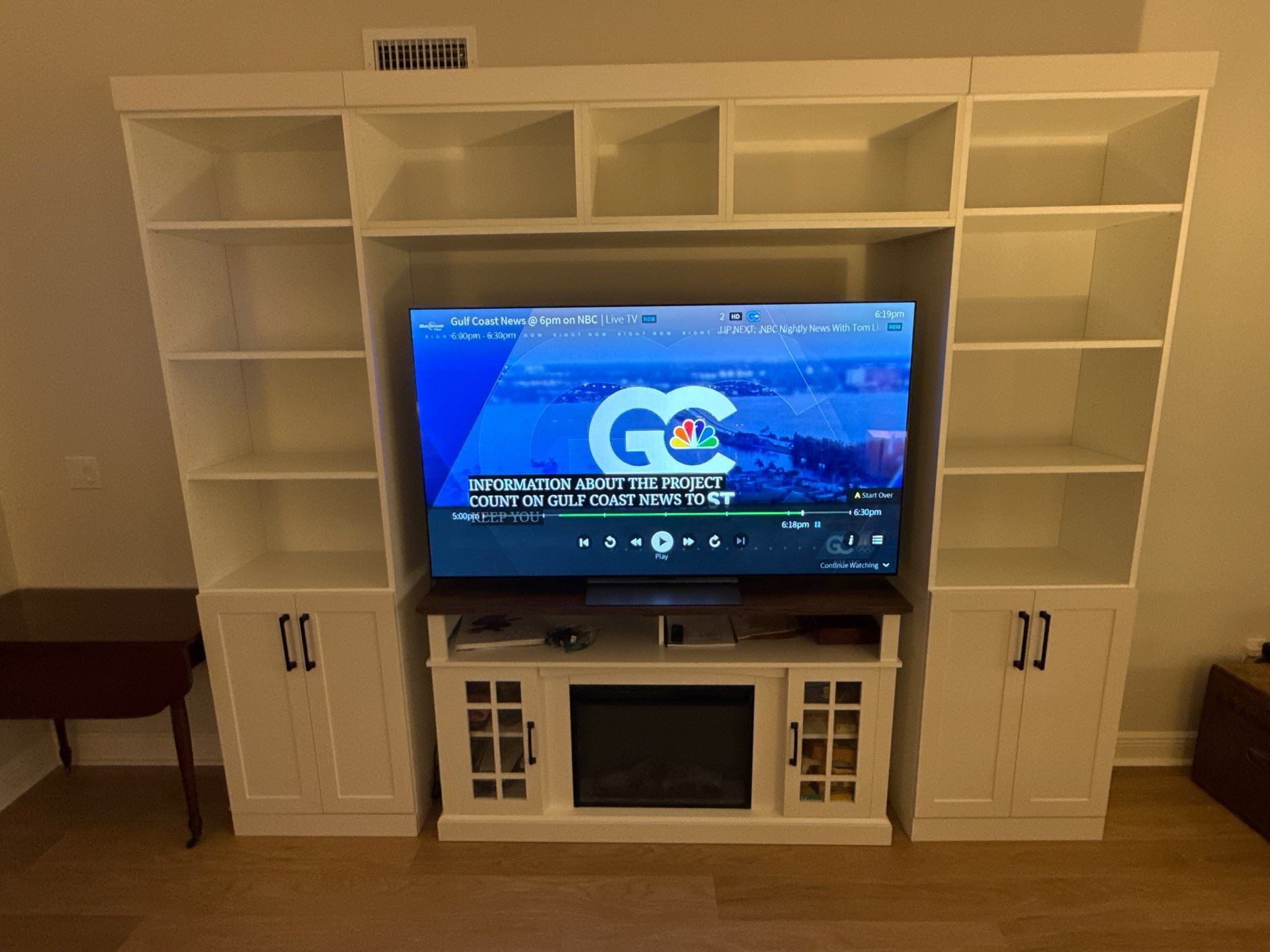Custom Built-In Entertainment Center & Shelving Wall by More Space Place