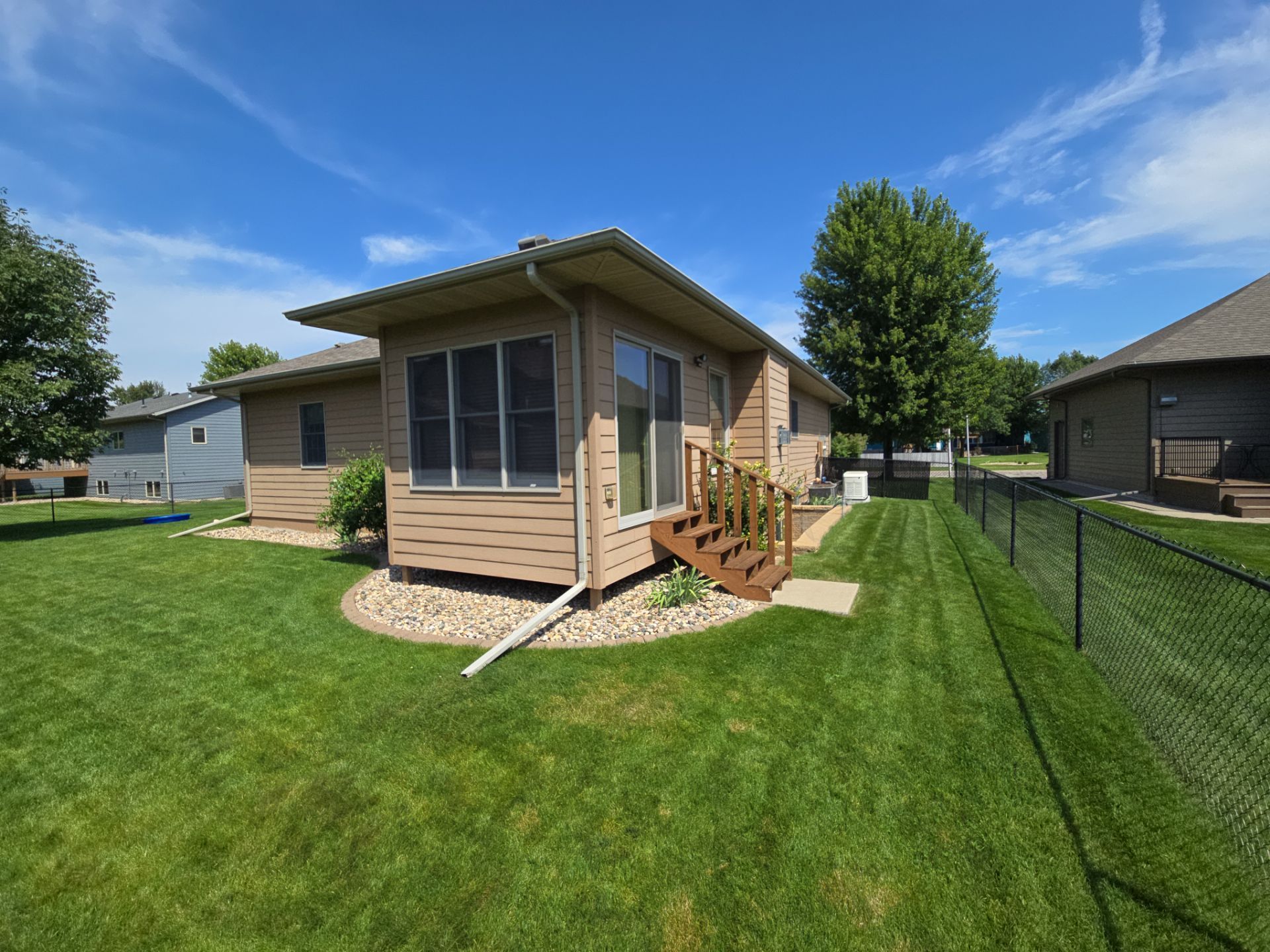 Sioux Falls Residential Exterior Door and Siding Refresh by Select Painting, Coatings & Garage Cabinets