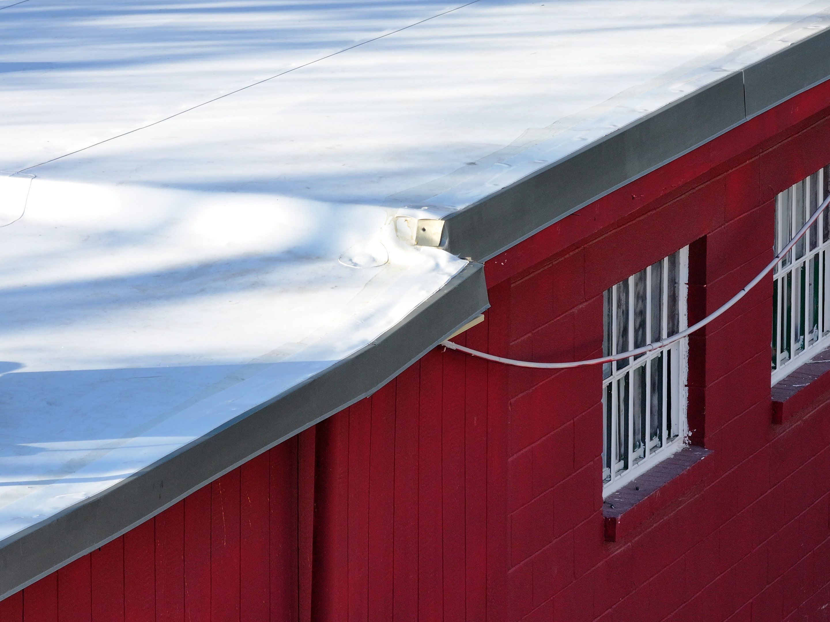 Commercial roofing overlay using GAF TPO over an old ballast roof by Becker Roofing and Exteriors