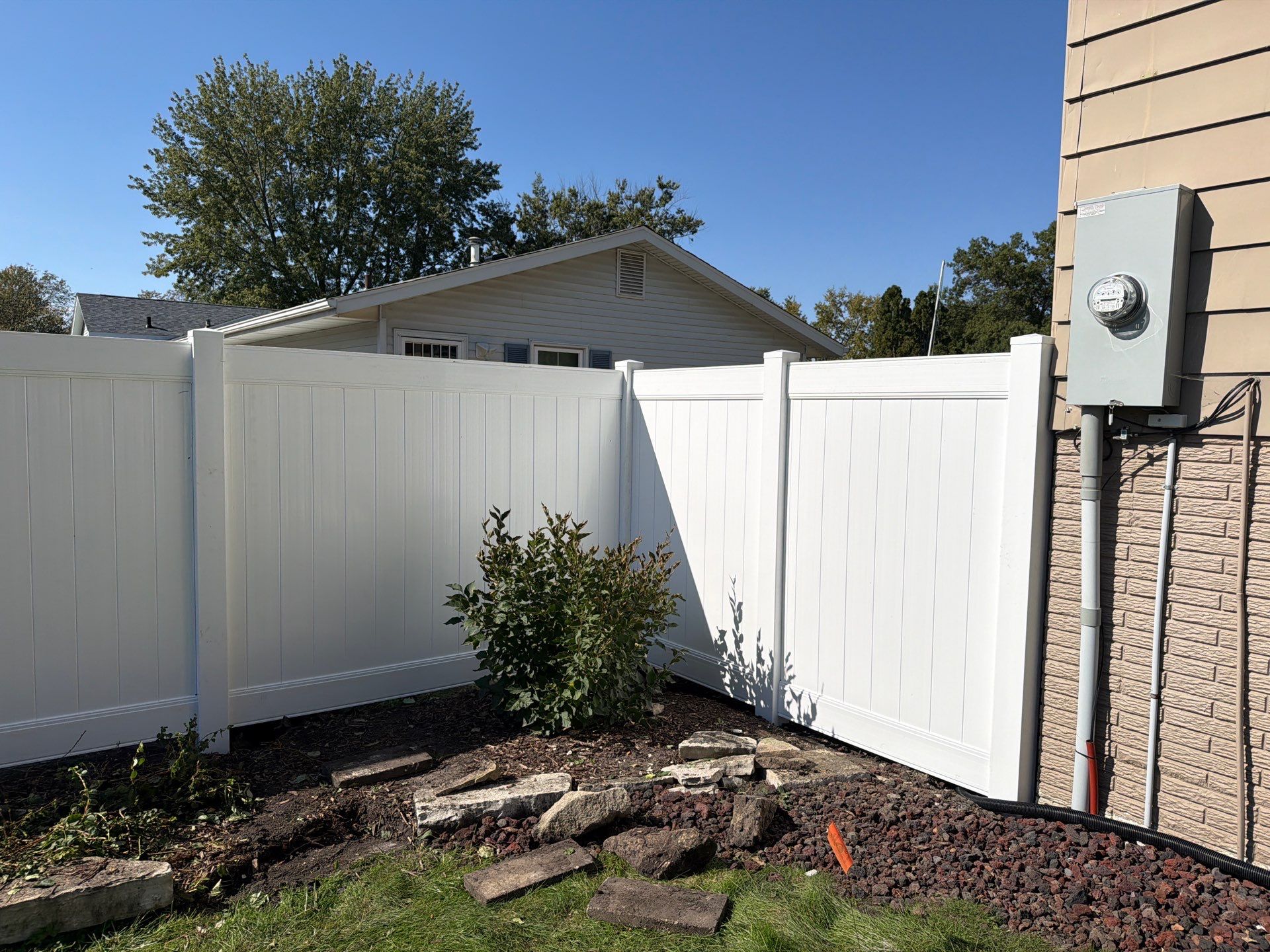 Custom Vinyl Privacy and Black Chain Link Fence Installation in Cedar Falls by Perfect Picket Fence and Stain