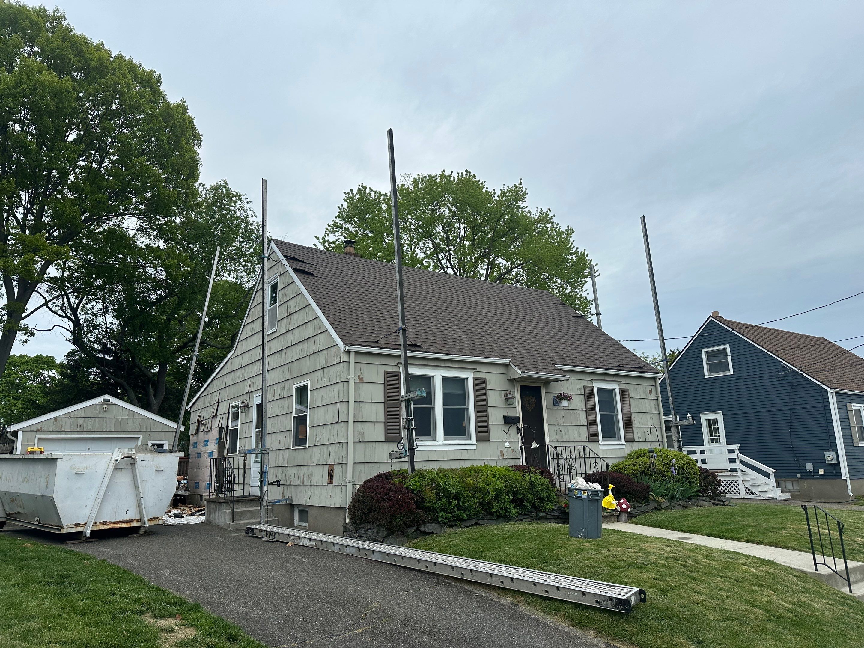 New Vinyl Siding Installation for Milford Home and Detached Garage by A Plus Exterior