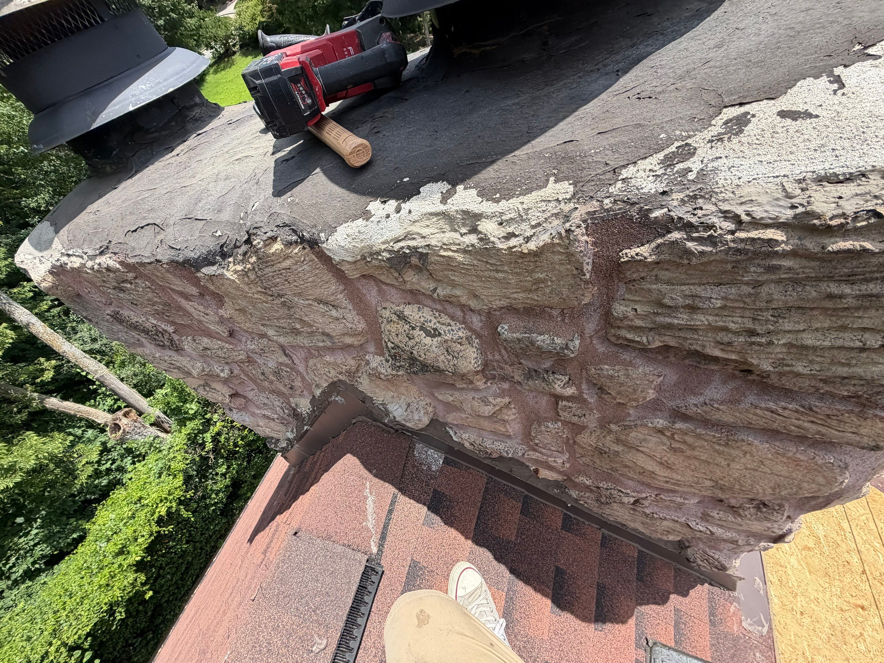 Structural Stone Chimney Restoration and Roof Repair in Leavenworth by Summit Roofing