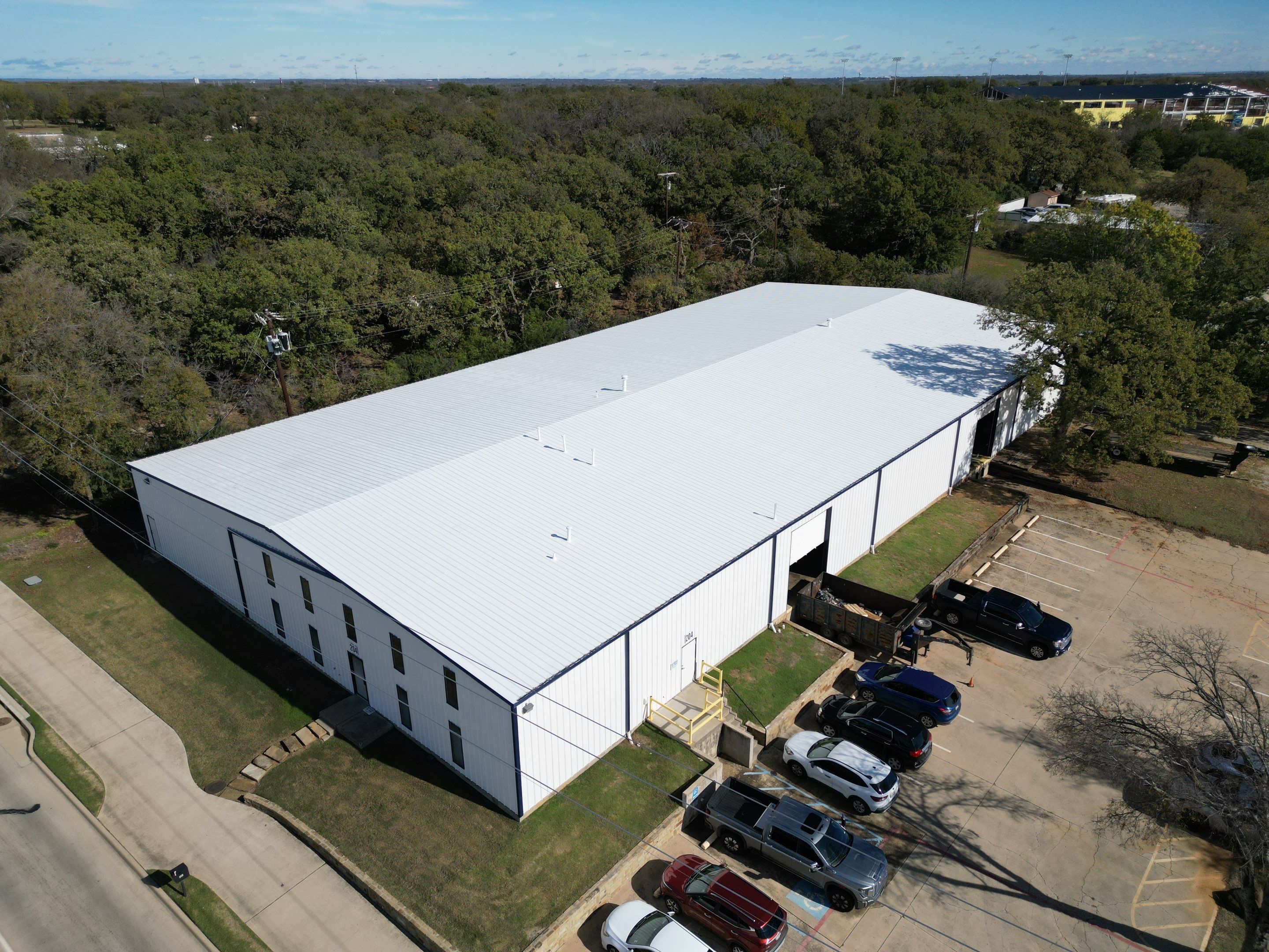 Silicone Coating Metal Rehab by First Out Roofing 