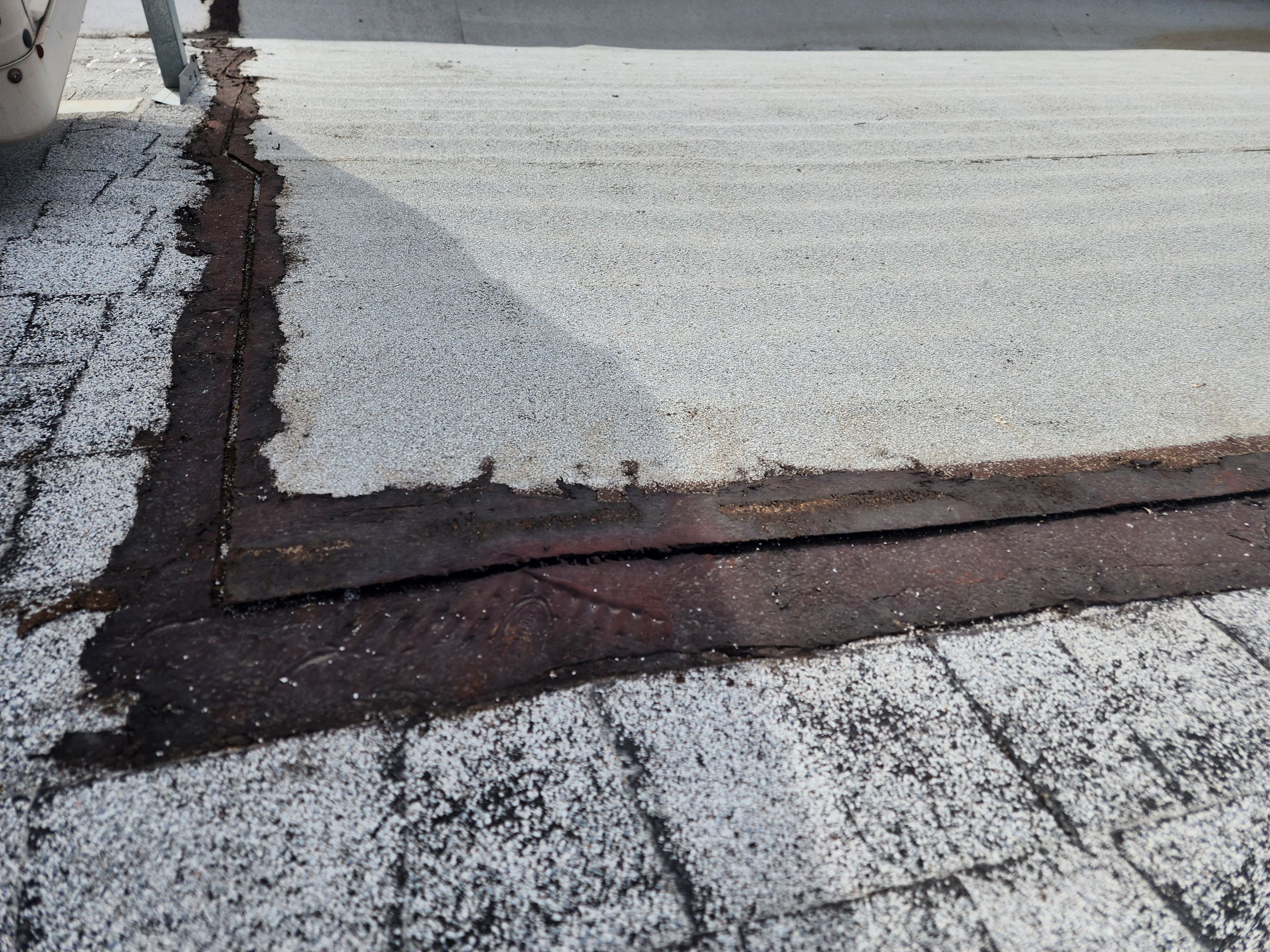 Foam and coatings on commercial roof by Straight Edge Roofing Inc