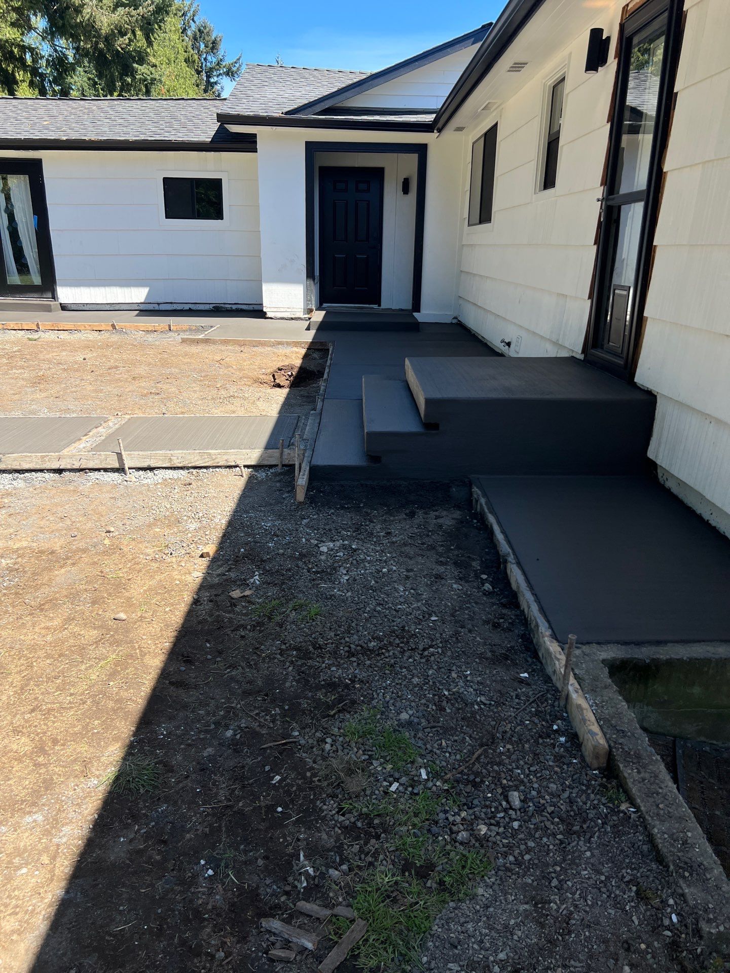 John | Concrete Backyard Walkway by Jireh Asphalt & Concrete Inc 