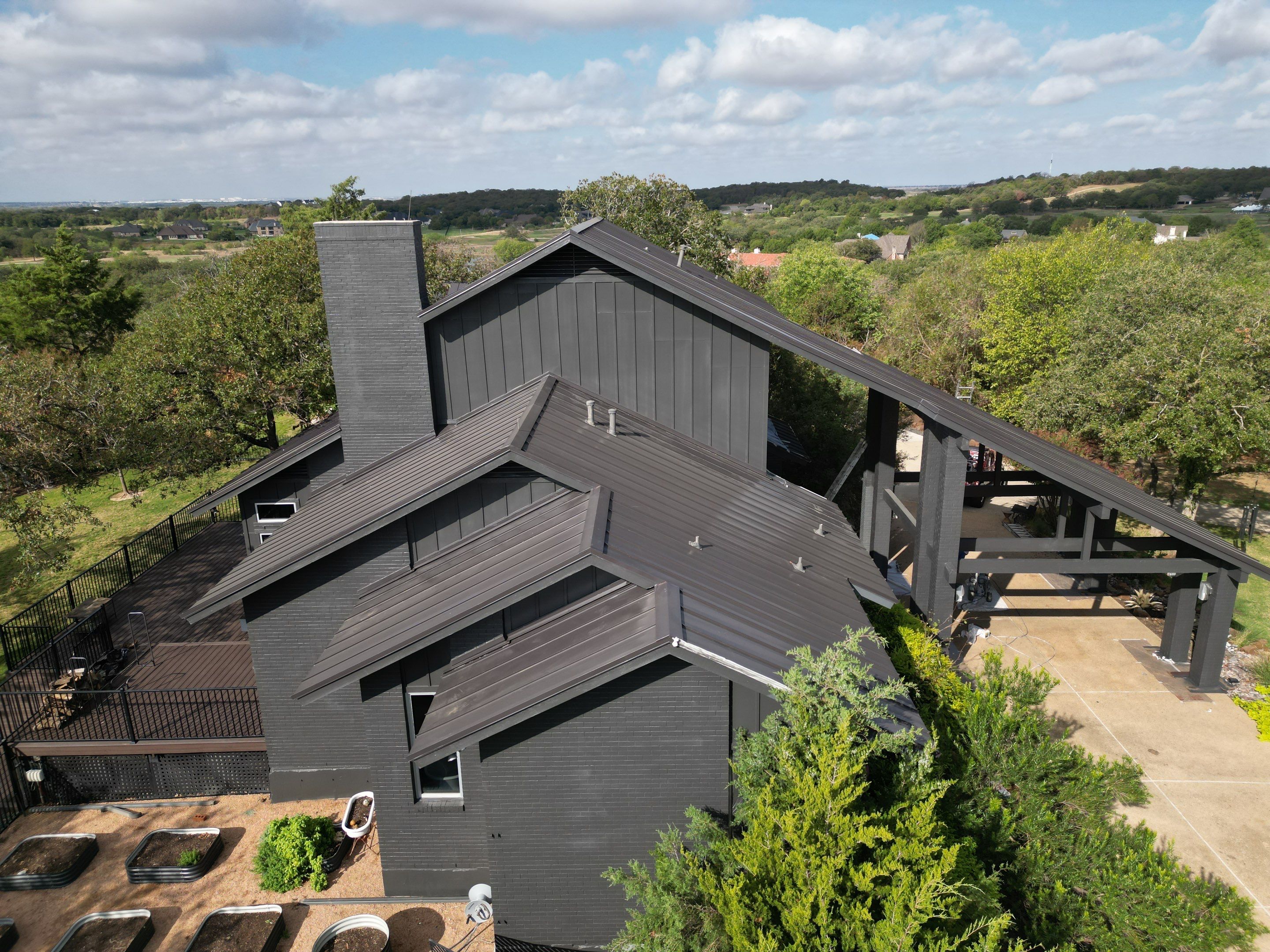 Dark Bronze Standing Seam Metal Roof by First Out Roofing 