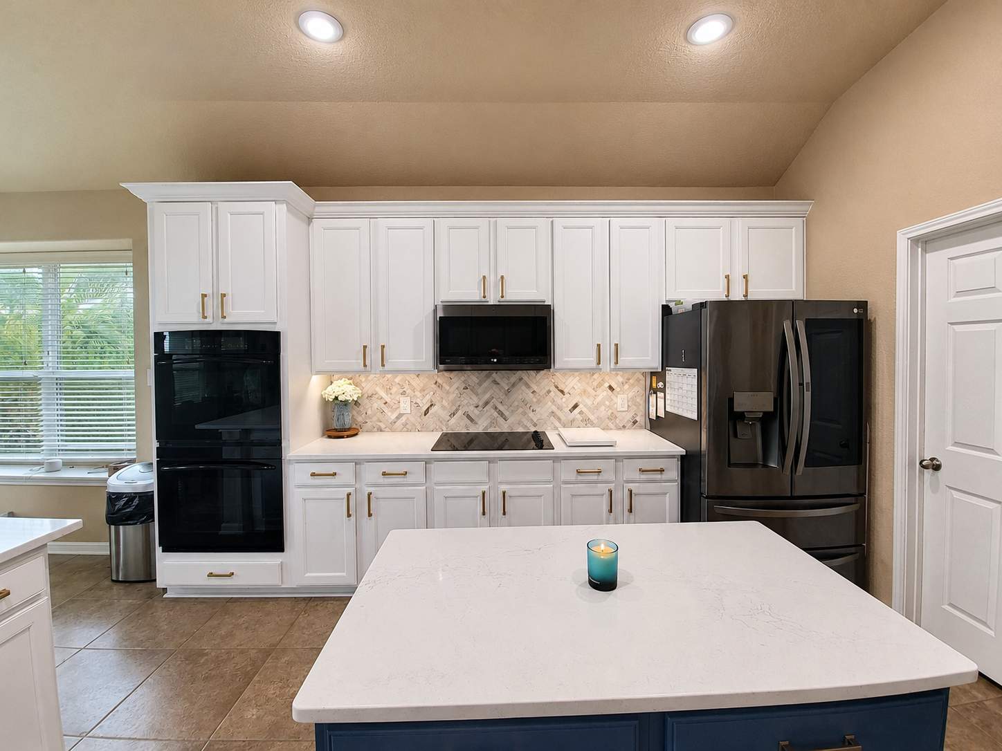Cibolo Kitchen Refresh with Painted Cabinets, Quartz Countertops & Herringbone Backsplash by Legacy Bath and Kitchen