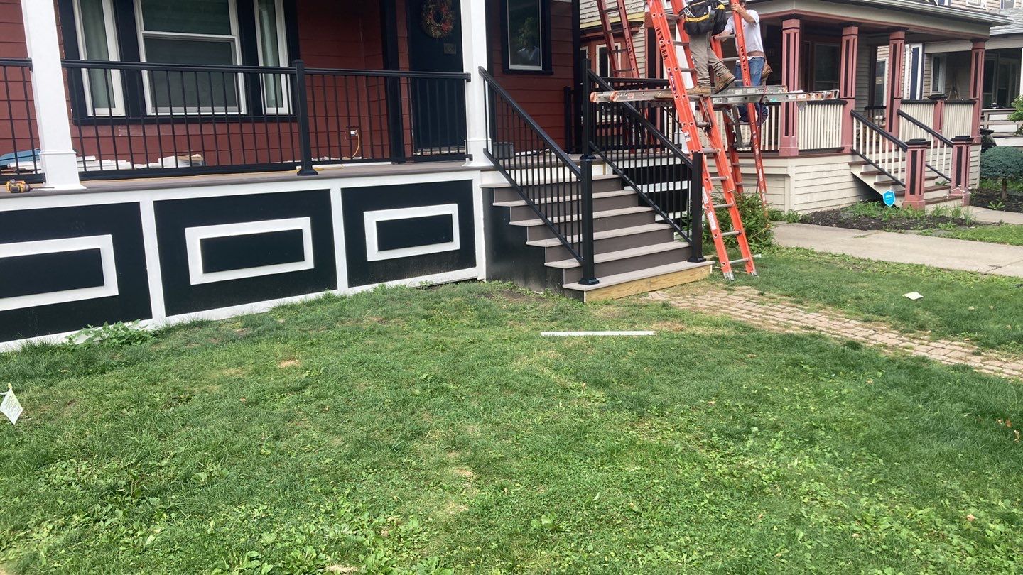 Exterior Renovations- Siding, Stamped Concrete, Porch, and Railings by Ivy Lea Construction