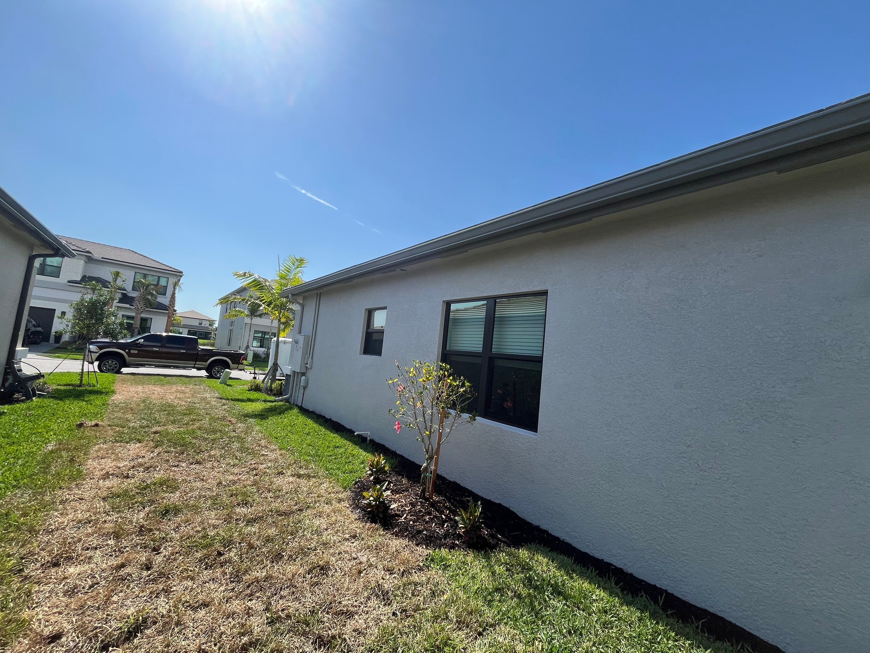 Grey Seamless Gutter Installation in Estero FL by Gutter Professors