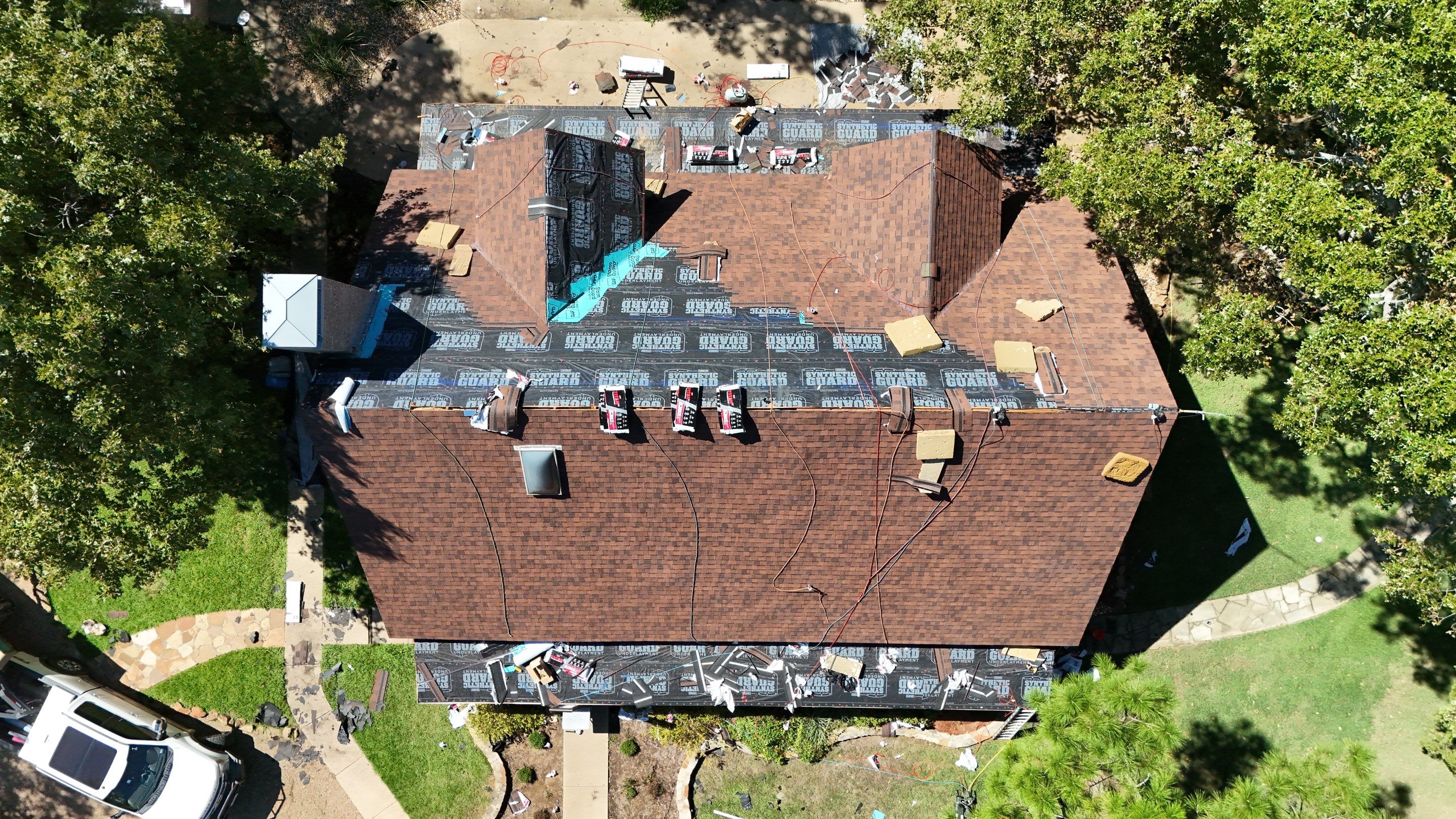 Multi-Building Log Cabin Roof Replacement with Architectural Shingles in Quitman by Armor Roofing | Exteriors