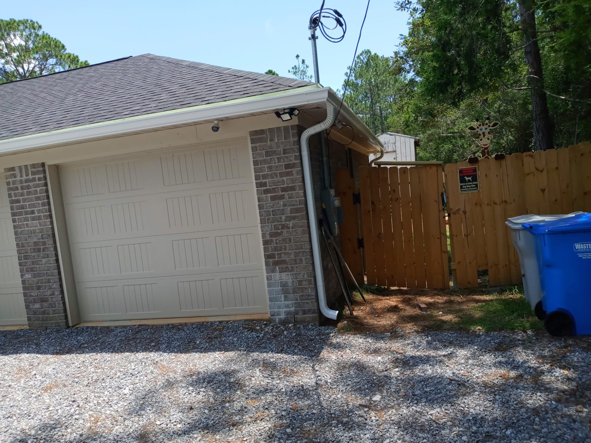 Downspout Installation using White Down Spouts in Milton FL by Gutter Professors