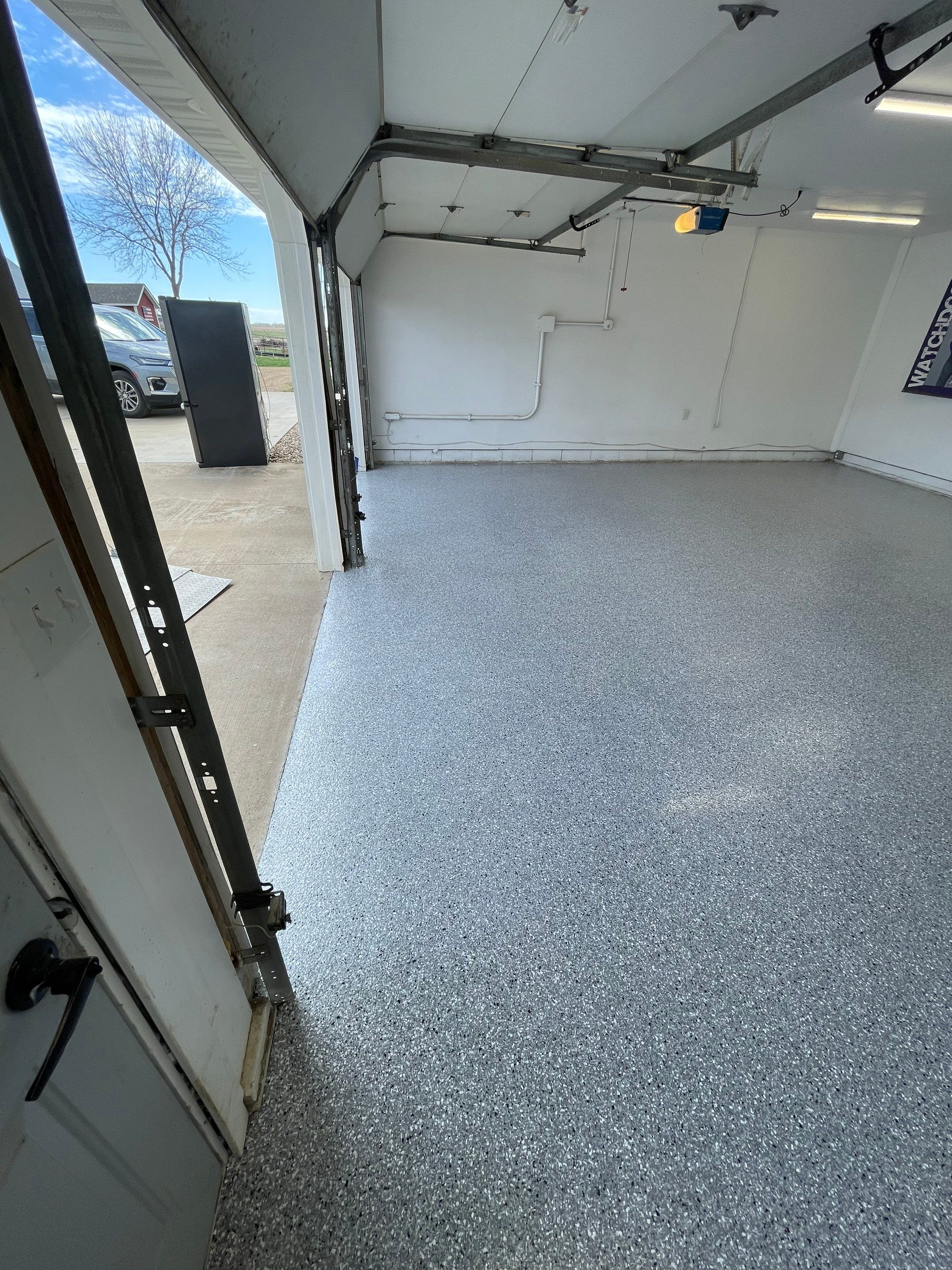 Feather Grey Garage Floor Coating and Crack Repair in Beresford by Select Painting, Coatings & Garage Cabinets