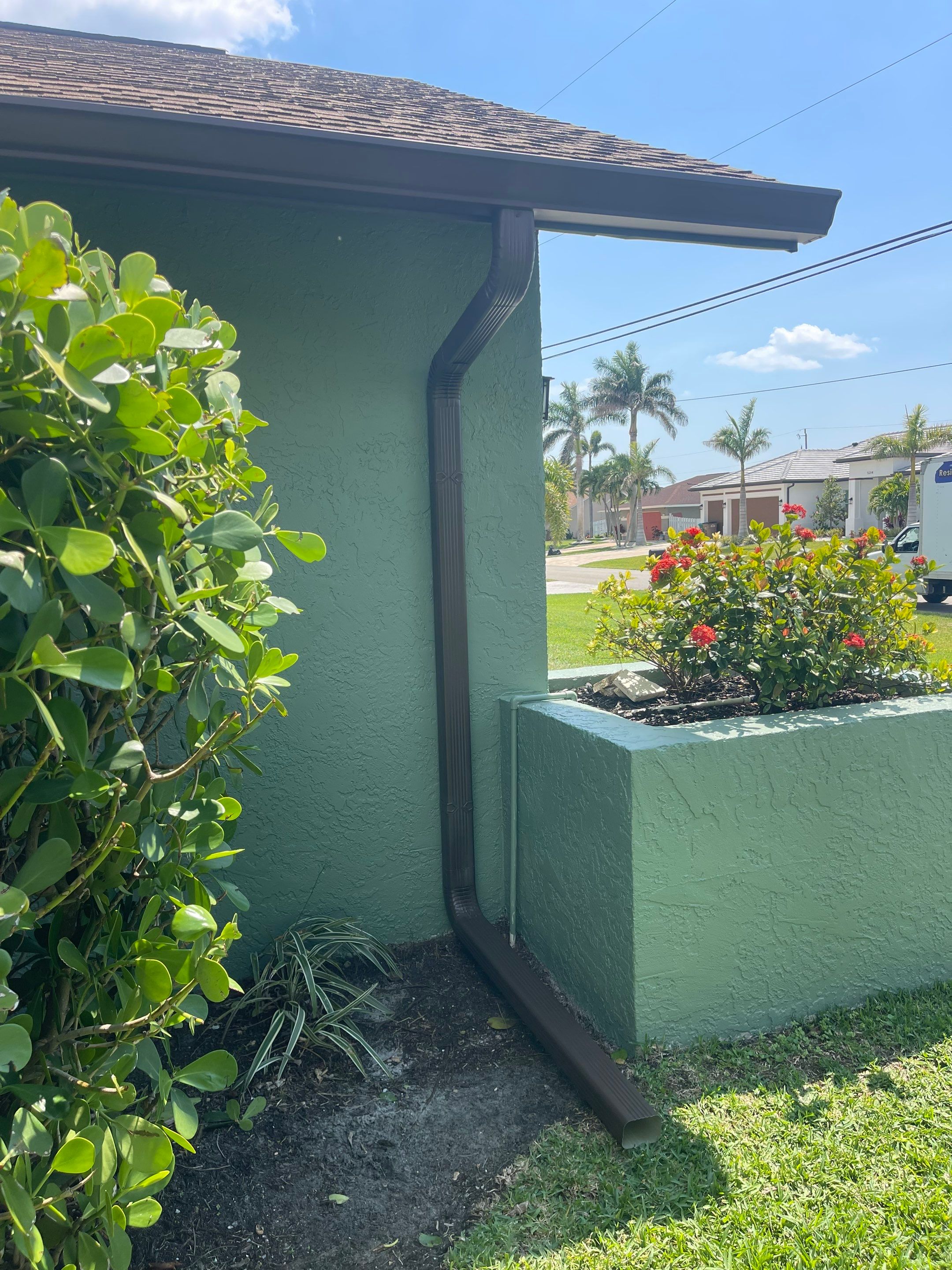 Musket Brown Seamless Gutter Installation Before Rainy Season in Cape Coral FL by Gutter Professors
