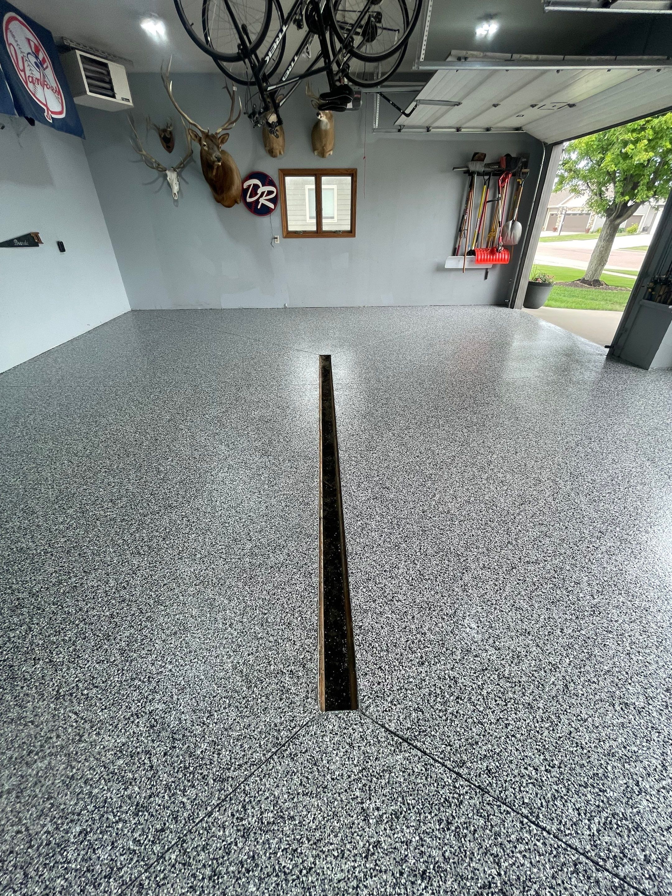 Full Garage Floor Epoxy Coating Installation in Dell Rapids by Select Painting, Coatings & Garage Cabinets