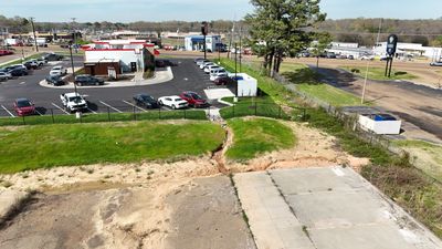 6' Black Chain Link Fence & Concrete Block Dumpster Enclosure