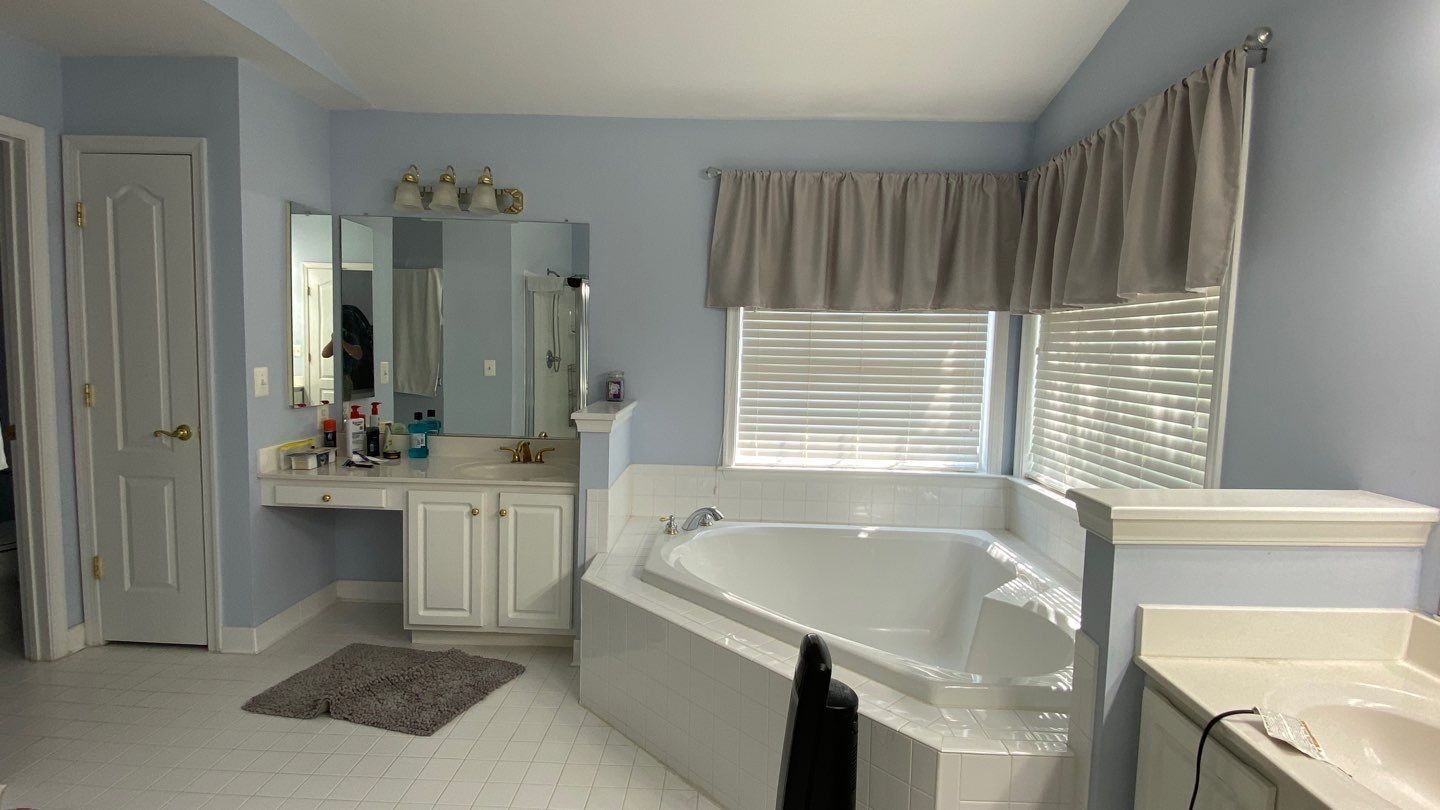 Bathroom Remodel using porcelain tiles , wood make vanetys , mirross , bathroom accessories  by Jesus Master Handyman LLC 