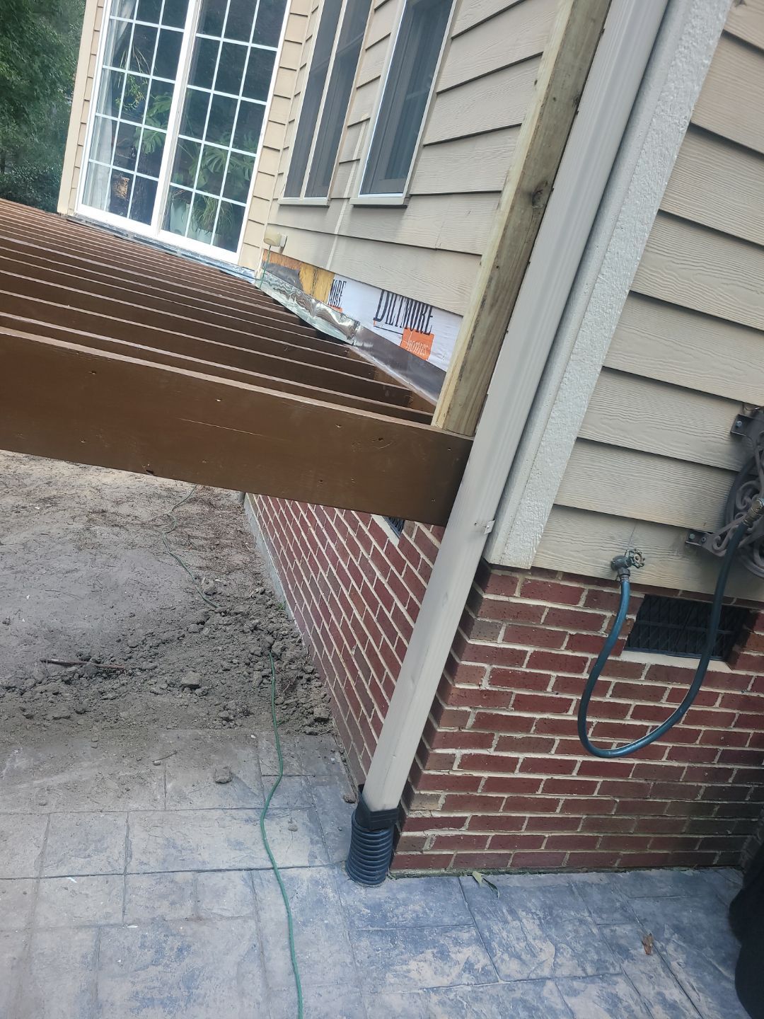 Fuquay-Varina Outdoor Upgrade – Composite Deck & Paved Landing by Elite Remodeling and Design LLC
