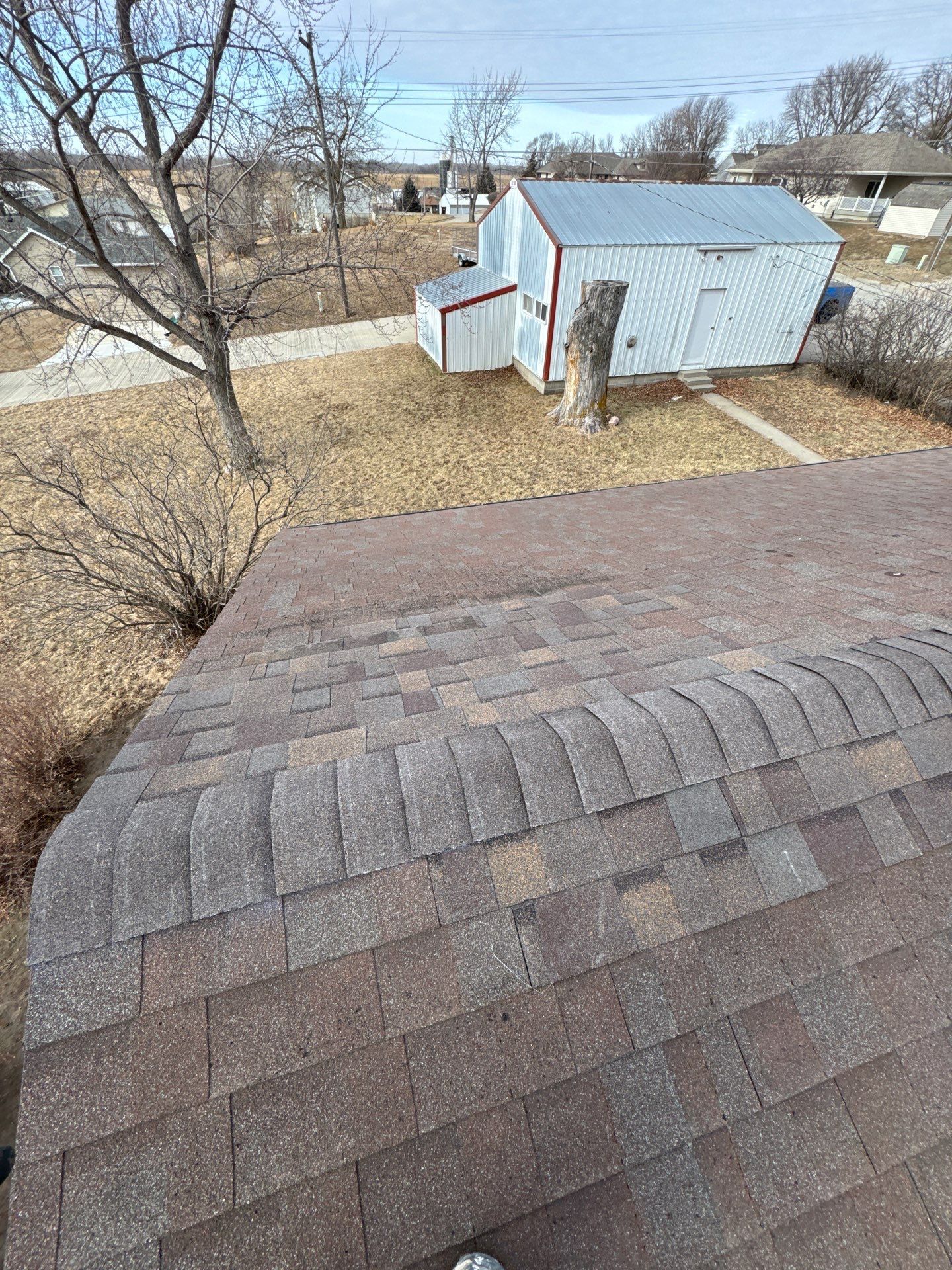 Shingle Roof Repair and Ridge Cap Replacement in Beemer, NE by Crows Roofing LLC