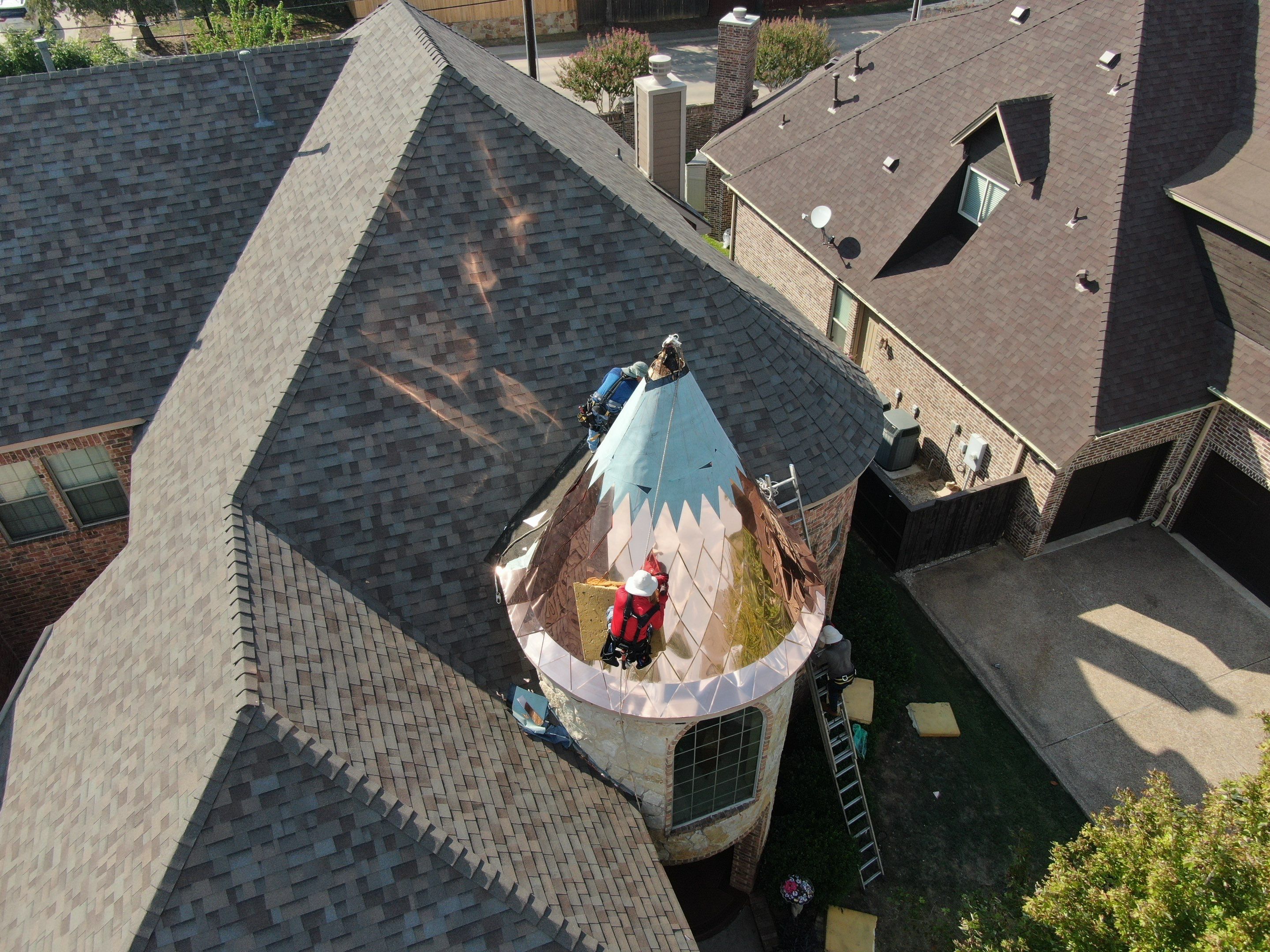 Installing Custom copper turret and Malarkey Vista Class 4 shingles Hail Damage Upgrade by Becker Roofing and Exteriors