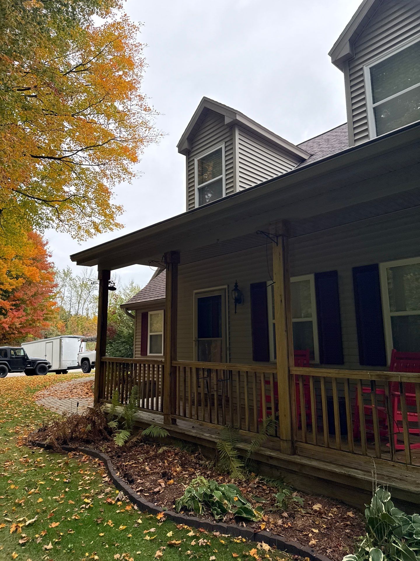 Traverse City Gutter Helmet Installation on a Shingled Roof Home by Rainbow Seamless Systems