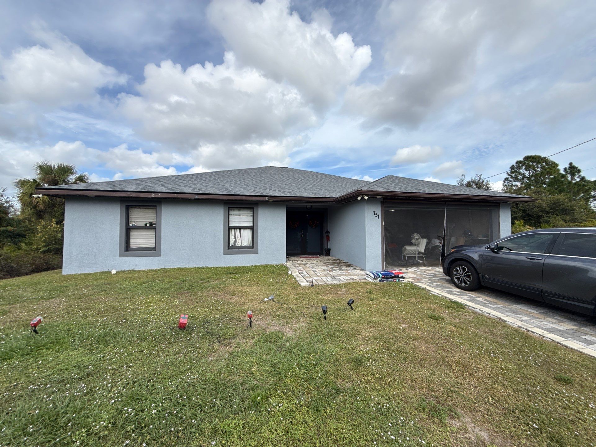 Black Seamless Gutters & Soffit/Fascia in Lehigh Acres FL by Gutter Professors