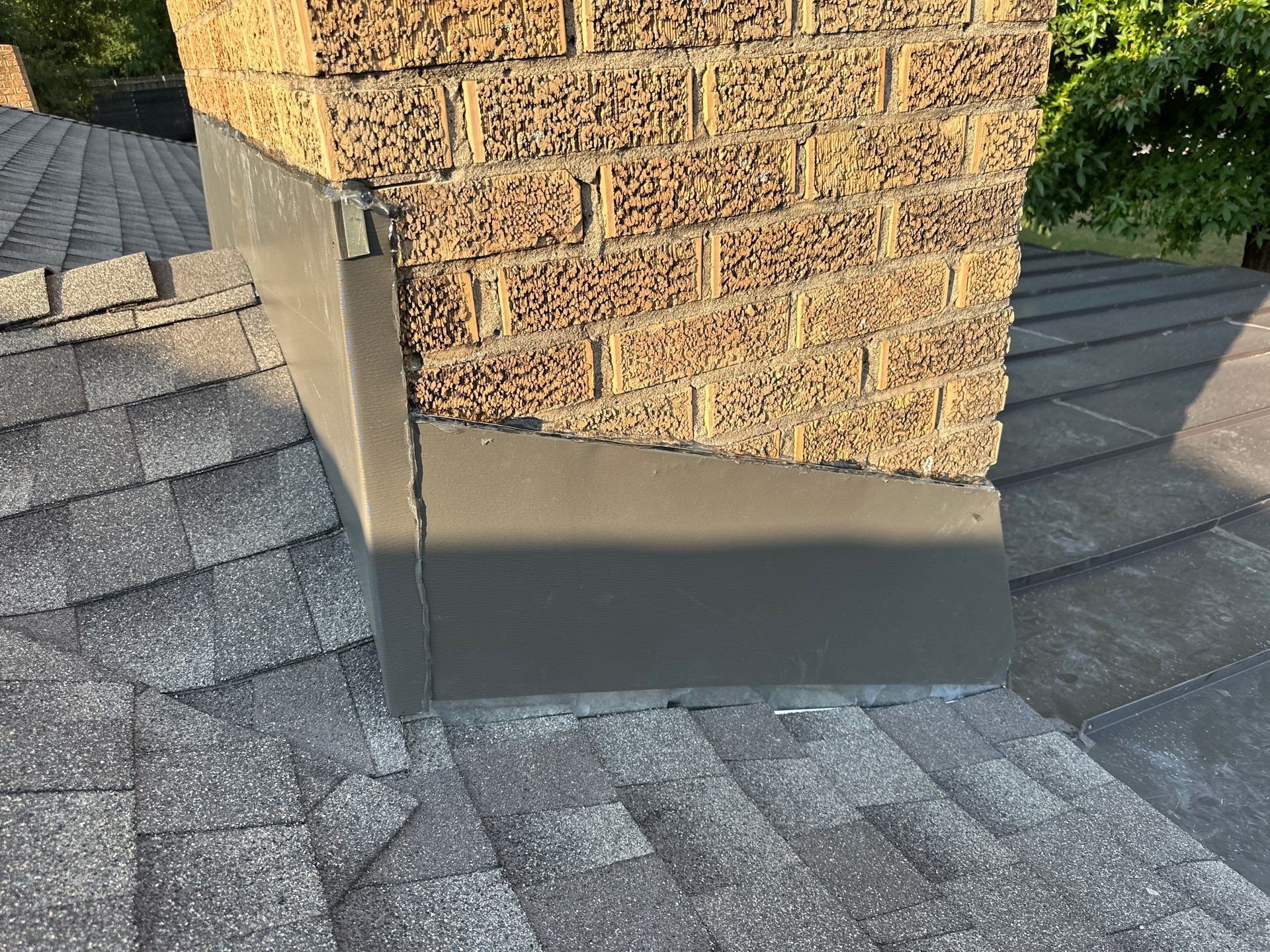 roof replacement, chimney flashing repair, and skylight replacement in Oklahoma City by McCann's Roofing and Construction