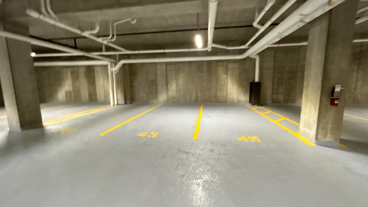 Parking garage using Hot water by Northern Power Washing LLC.