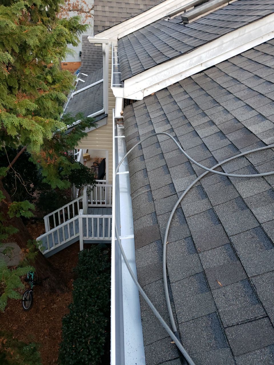 Gutter Cleaning using water by G&H Home Tech Pros LLC