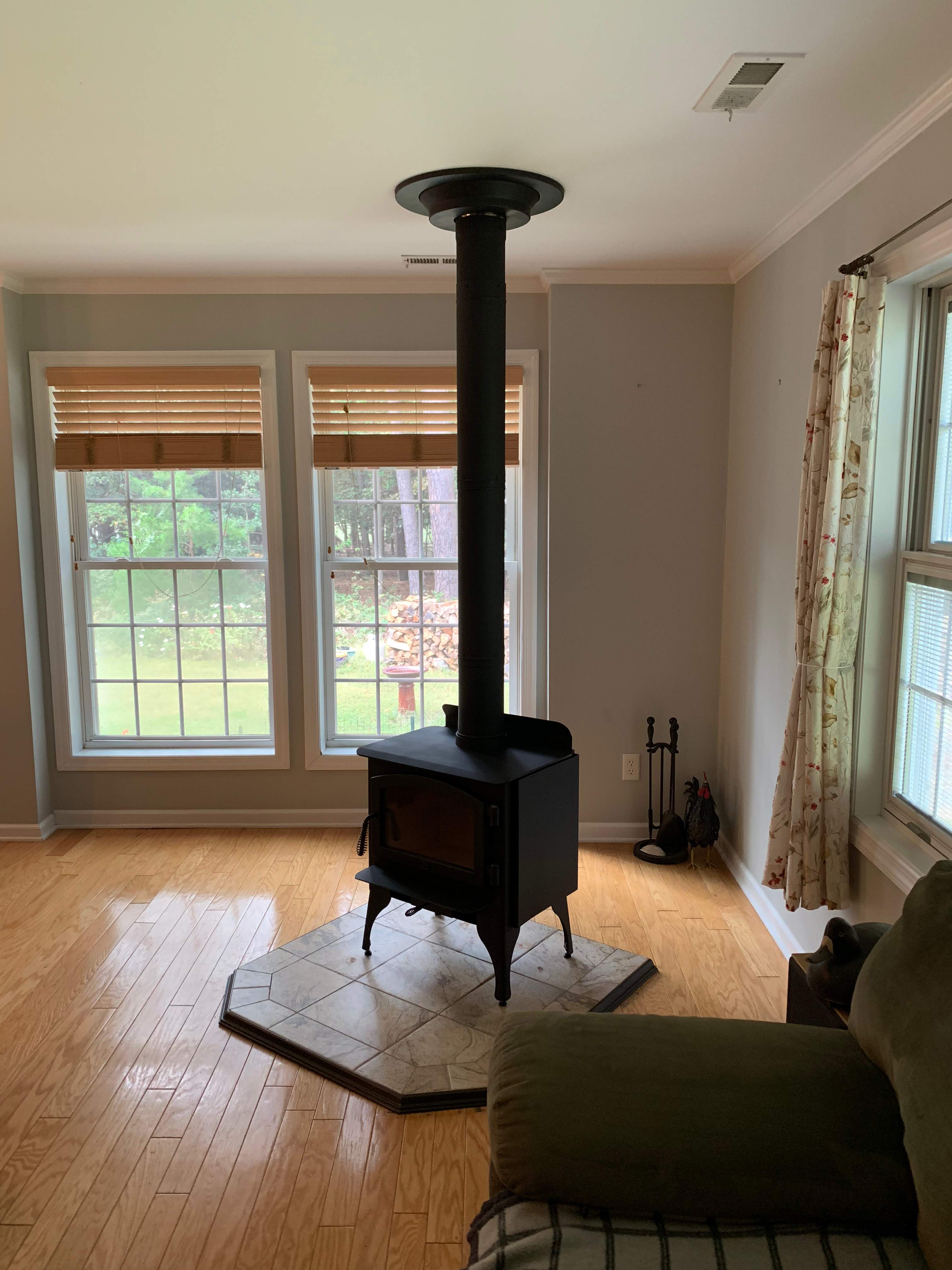 Freestanding Wood Stove by Premier Chimney and Roofing