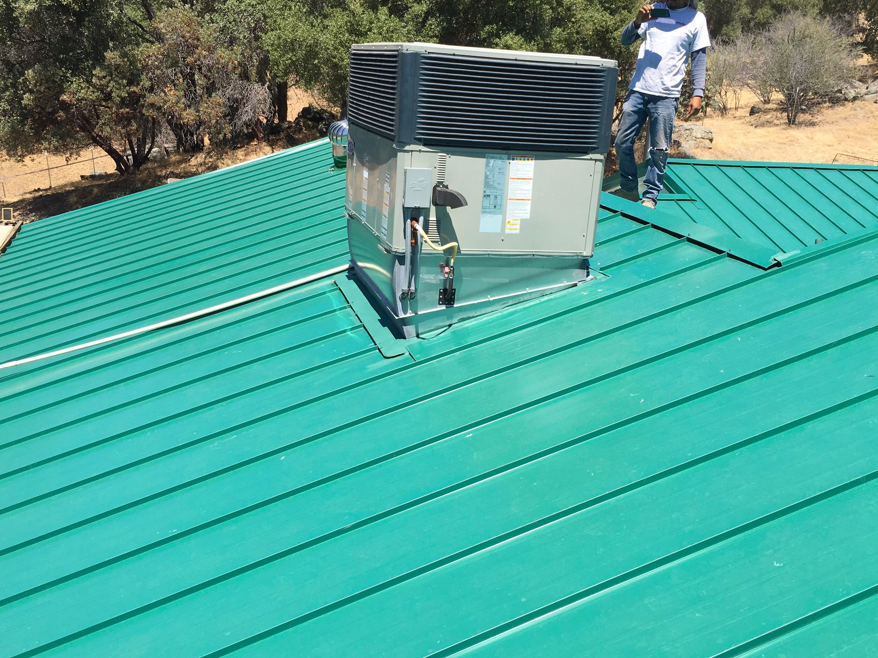 Metal roofing installation using Standing seam metal roofing system by Straight Edge Roofing Inc