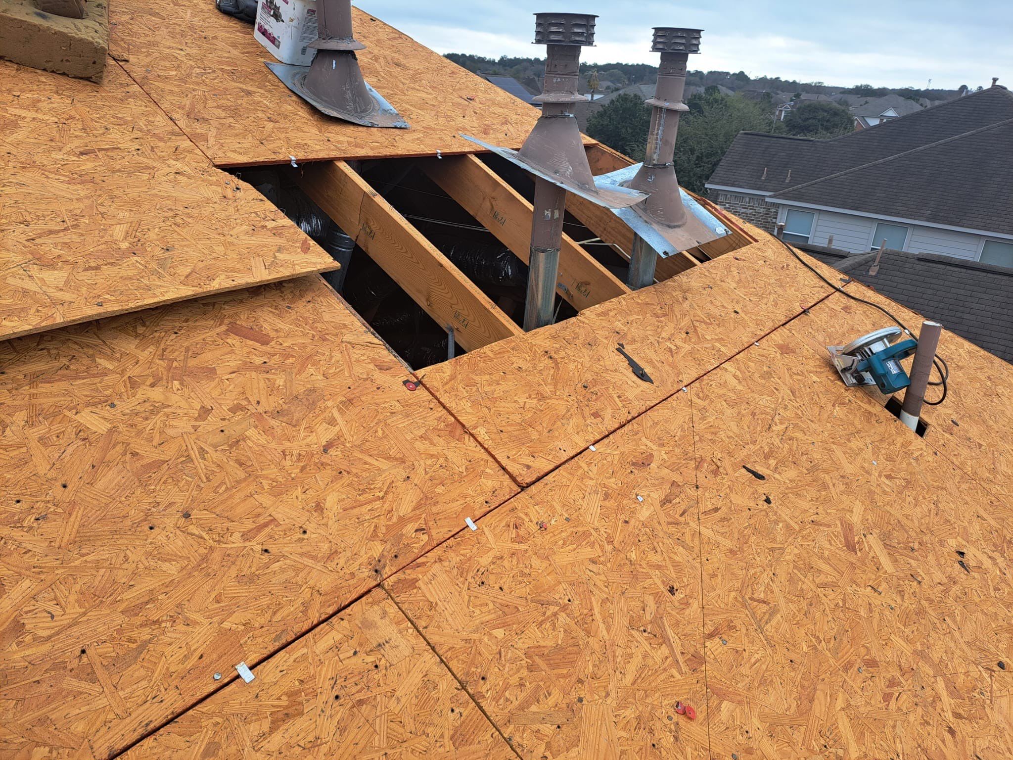 Slate-Gray Roof on Stone-Front Home — Spring, TX by PL Roofing & SB Roofing, LLC.
