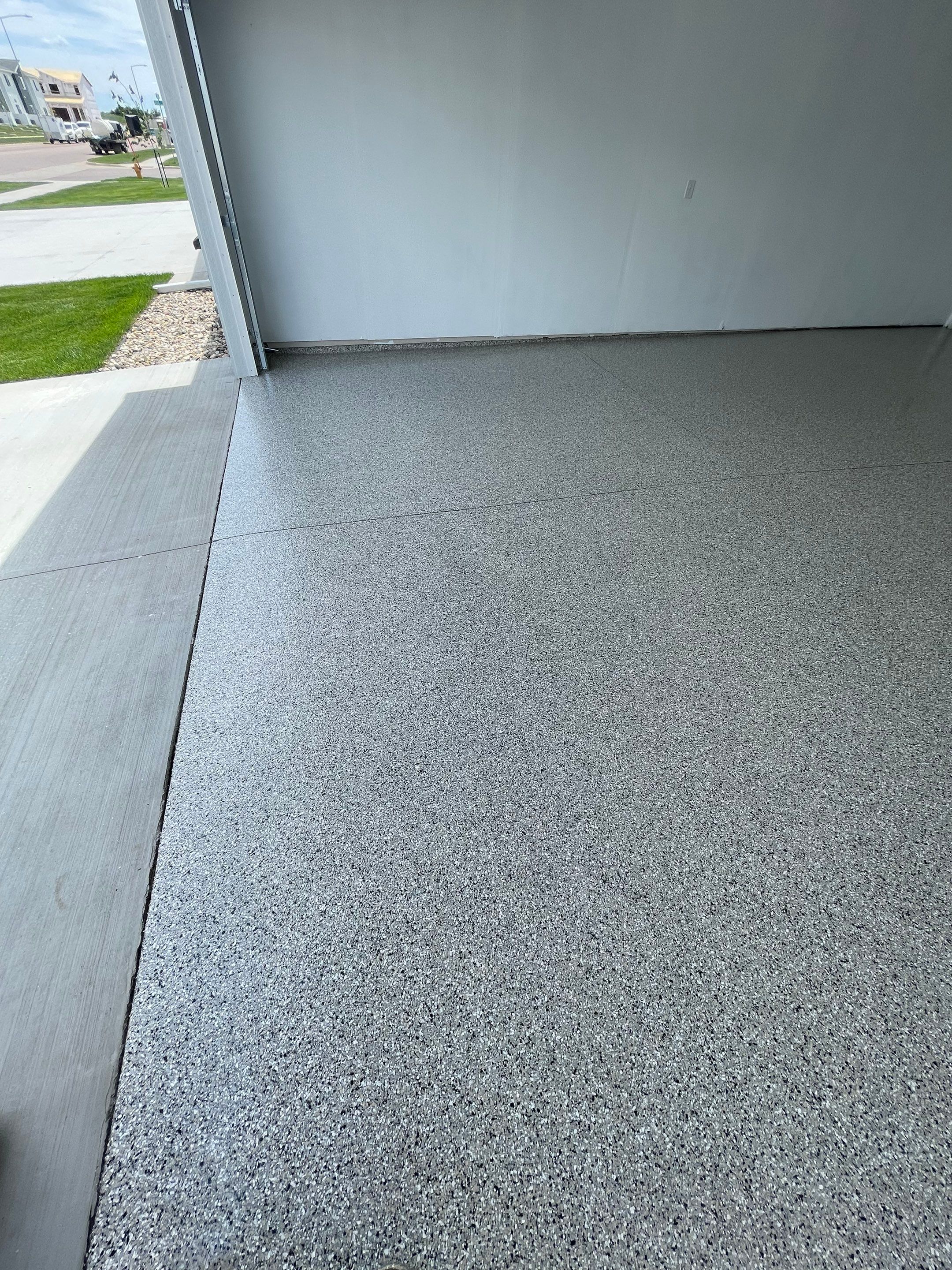 Sioux Falls Garage Floor Transformation with Cabin Fever Decorative Chips by Select Painting, Coatings & Garage Cabinets