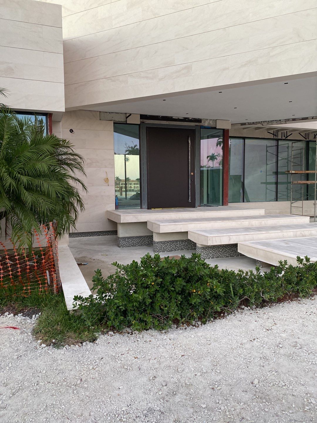 Custom Material Pivot Door installation by Impact Precious Windows and Doors