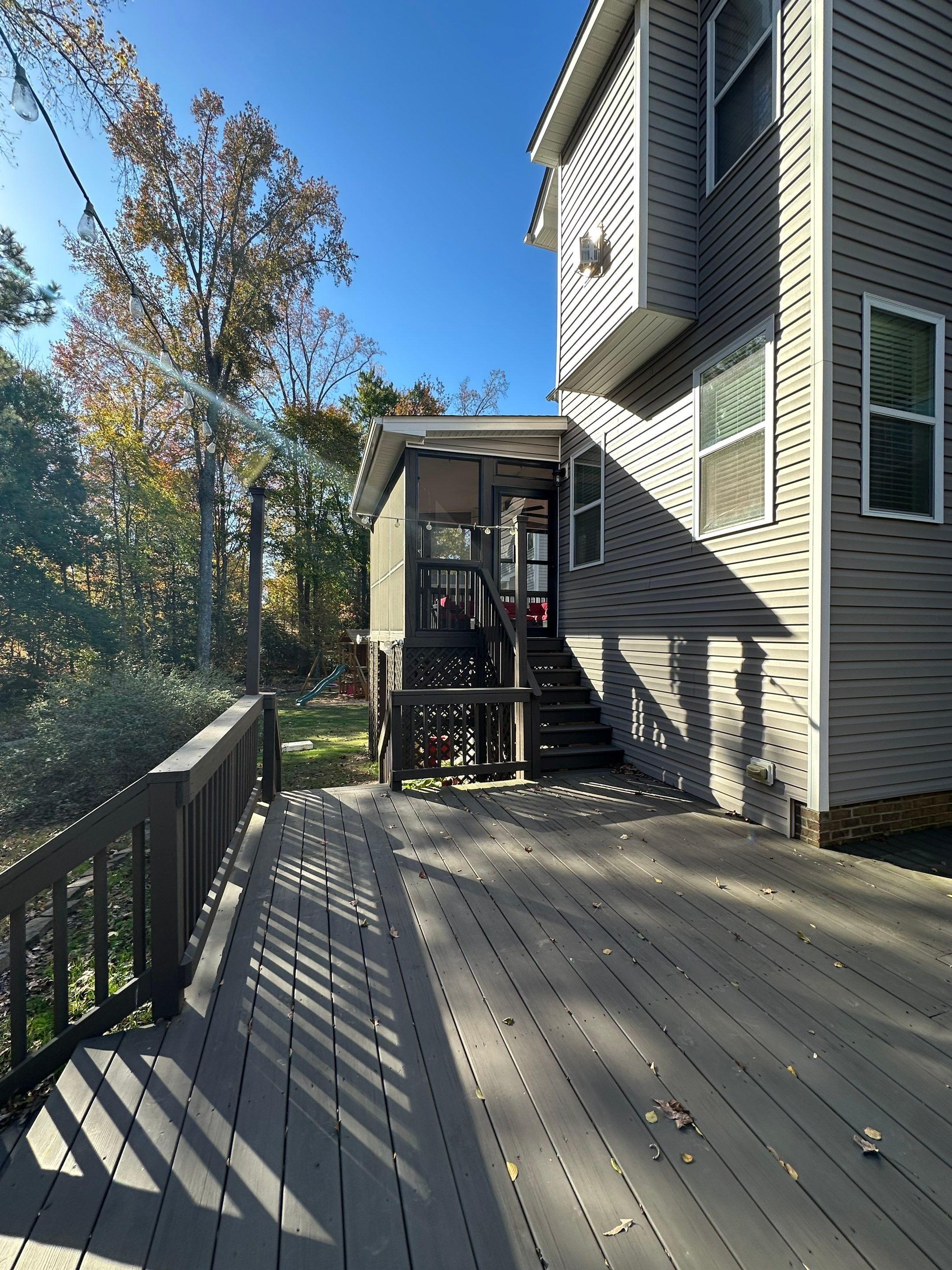 Elevated Screened Porch Addition and Deck Integration in Knightdale by The Remodeling Company