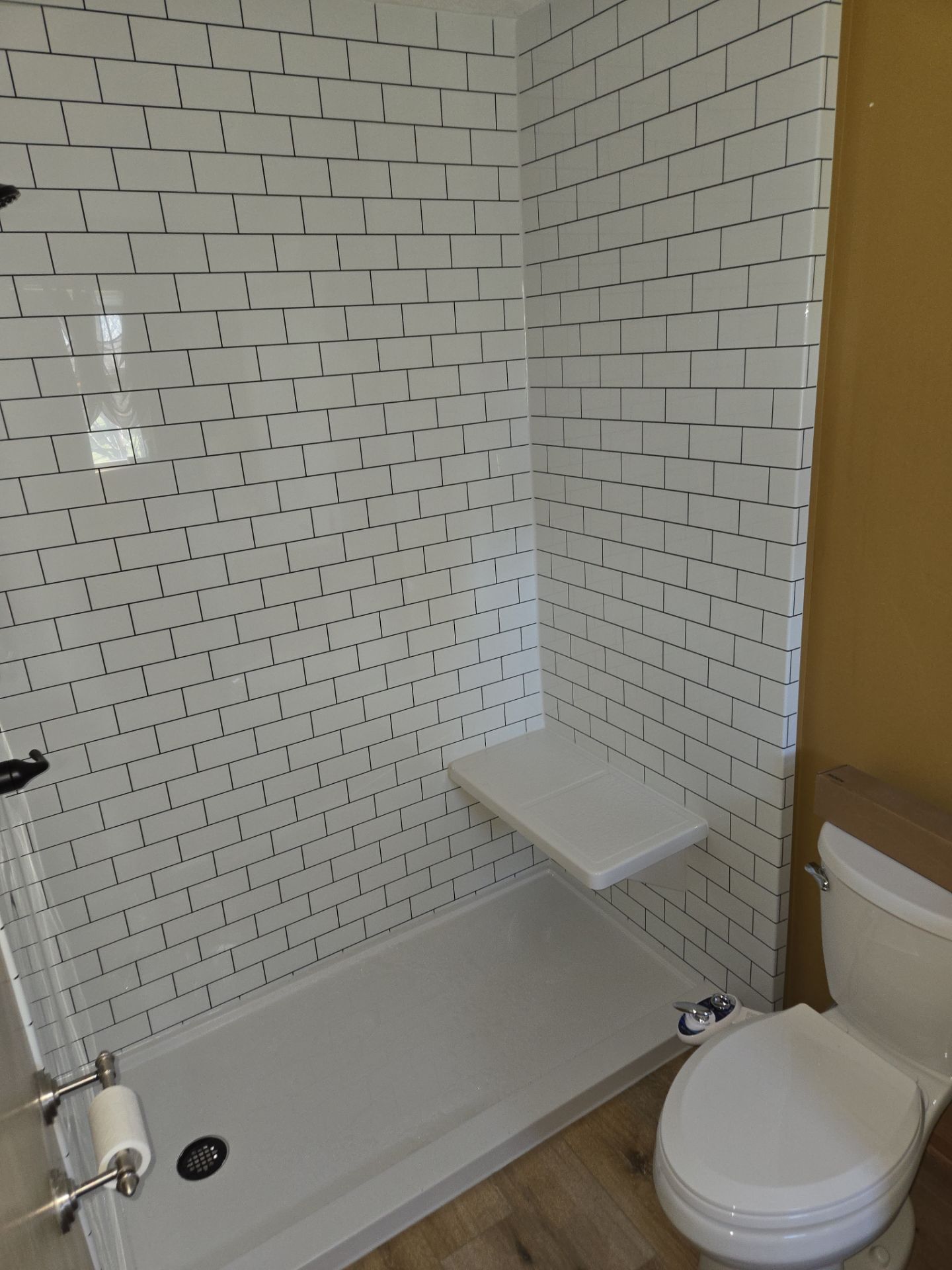Bathroom Remodel using Luxury Vinyl Plank by The Shower Company