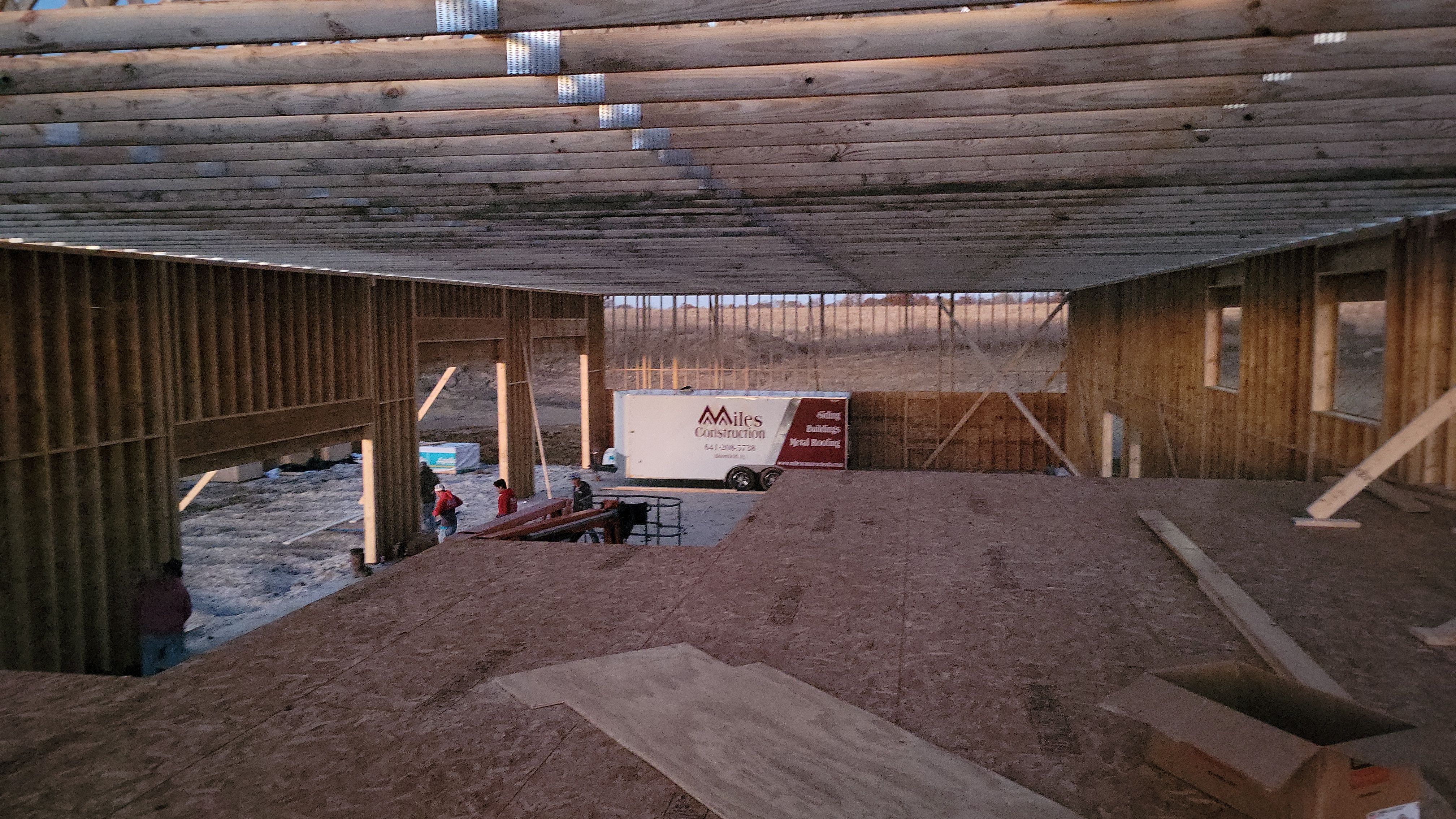 New Home construction w/ board and batten sides and metal roof  by Miles Construction 