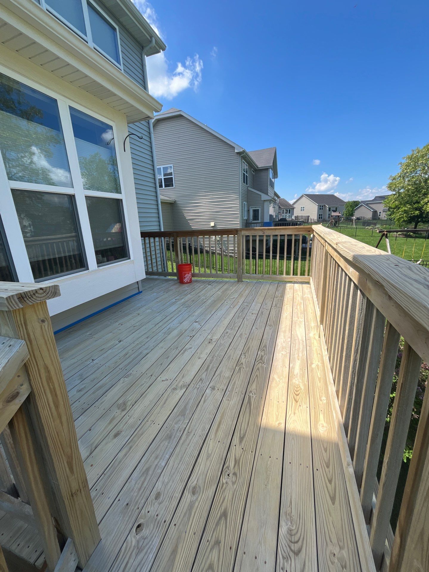 wood deck cleaning and staining by Northern Power Washing LLC.