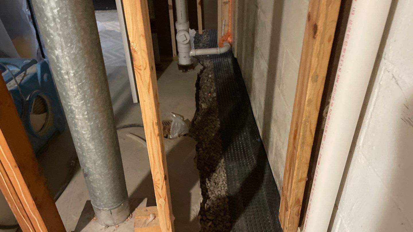 Interior Drain Tile & Buried Discharge in St. Anthony, MN by Waterproofing Northeast