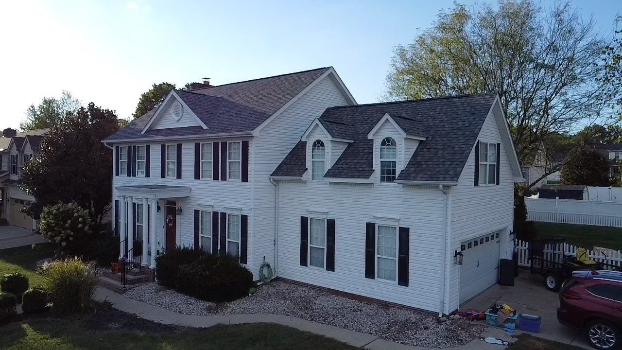 Landmark Pro, Siding, and 6" Gutters by Fahey Roofing + Contracting