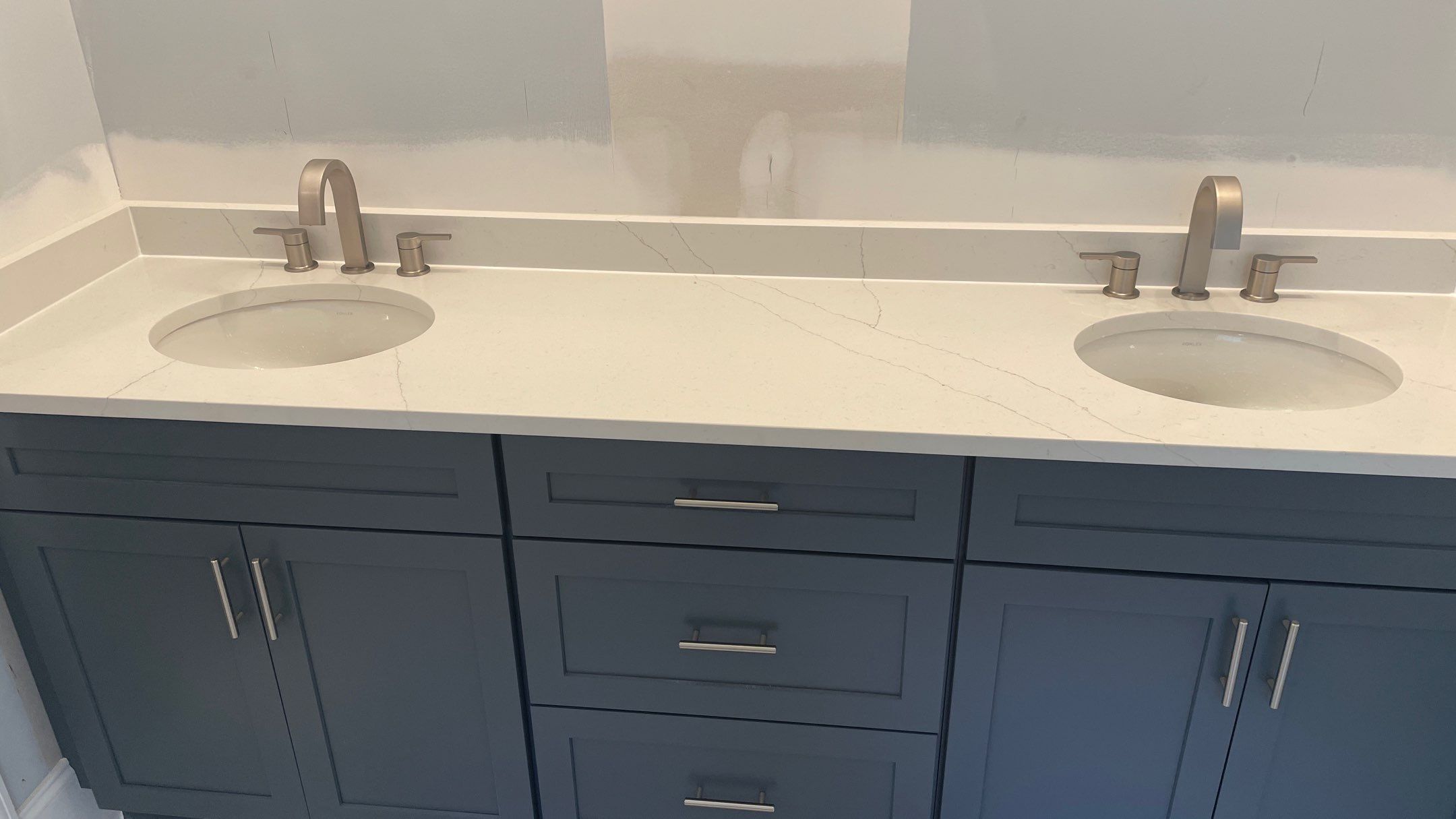 Bright Bathroom Remodel with Wall Removal, Stand Alone Tub and New Vanity by Footprints Floors of Coastal Carolina