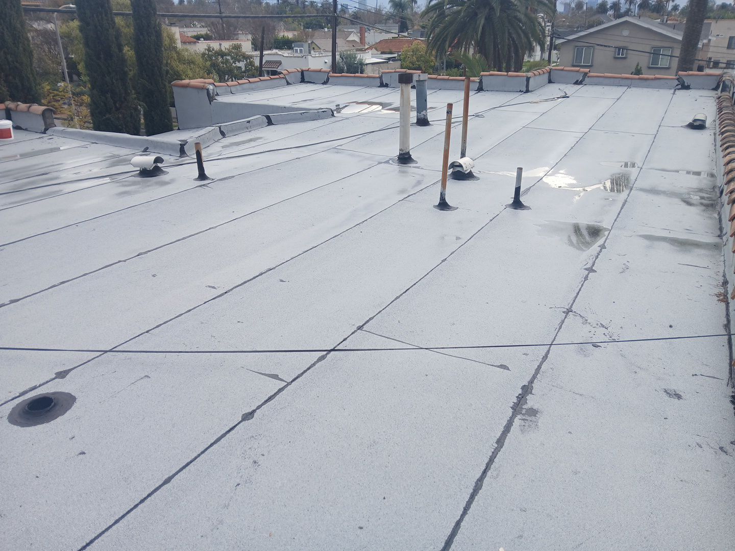 Silicone Membrane Installation using American Standard Coatings Silicone-S by Hull Brothers Roofing