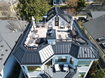 Seattle Queen Anne Rooftop Deck and Roof Replacement using Standing Seam Metal - Black