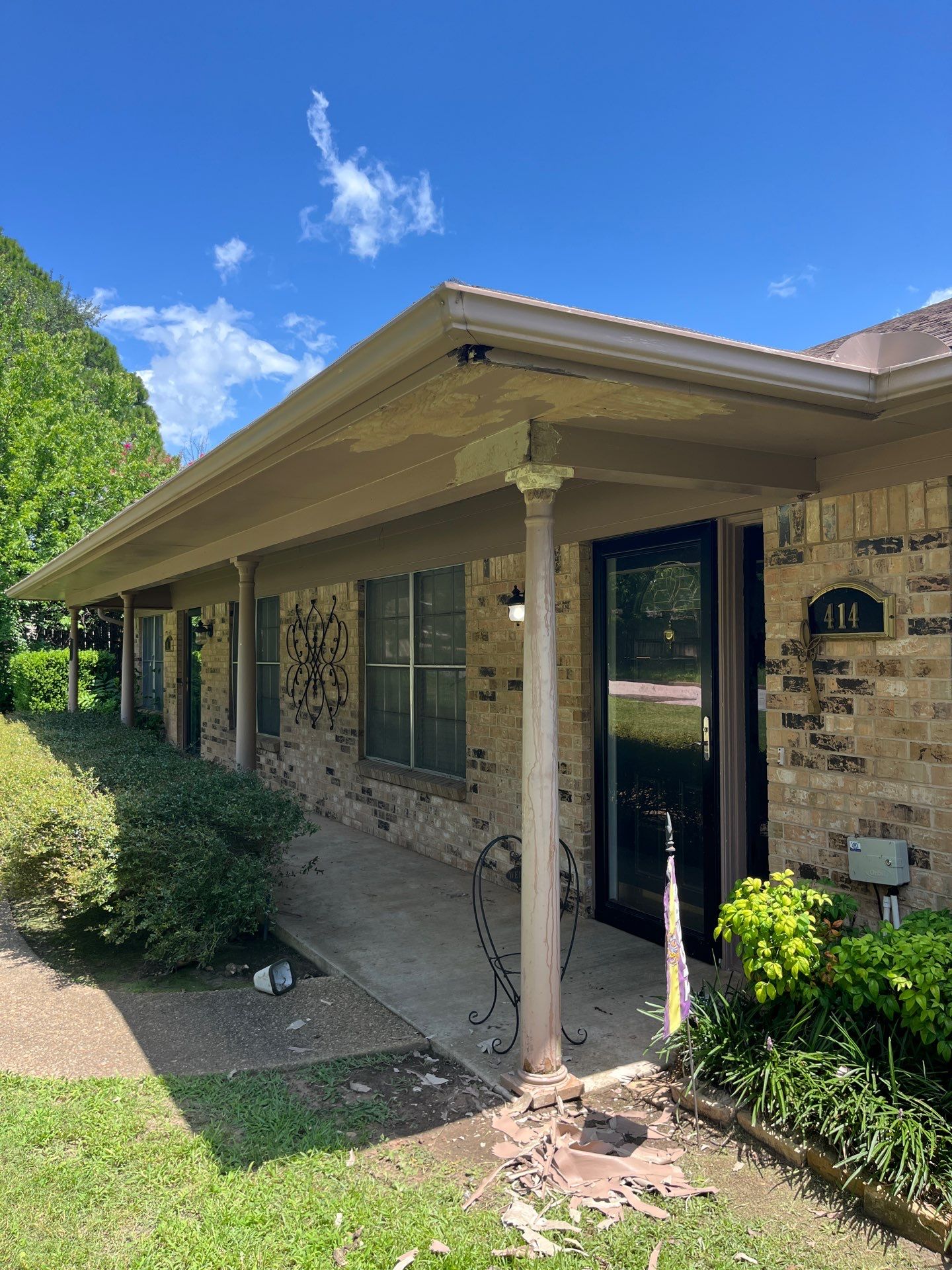 Exterior Painting in Tyler, TX | Eaves, Door & Columns in Elegant Black by Quality Coats Painting