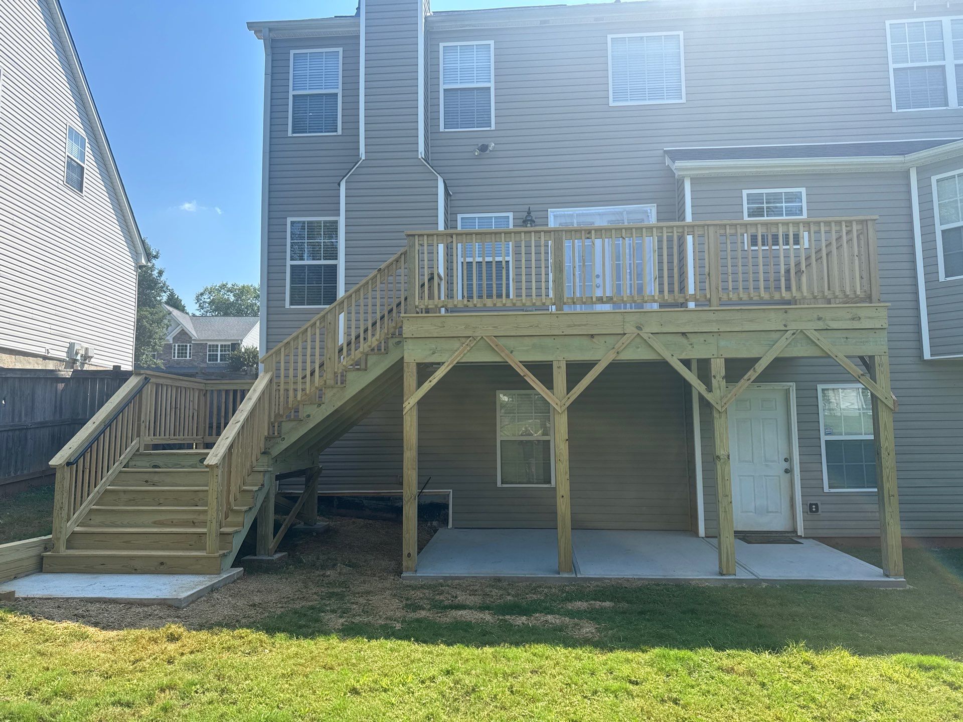 Backyard Deck Expansion & Custom Staircase Installation in Suwanee. by Swift Home Renovations